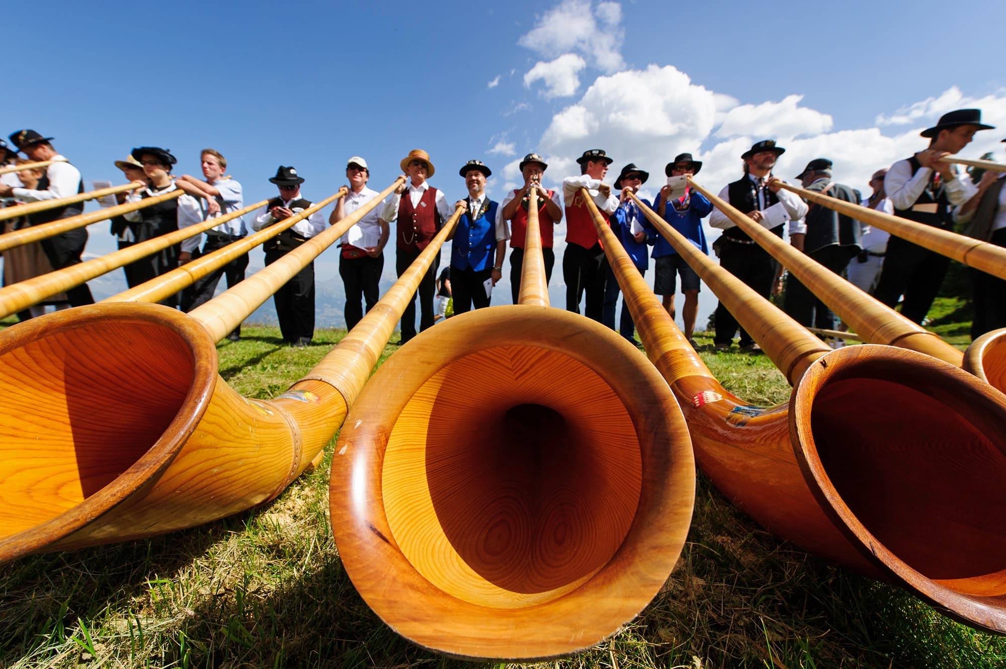 Alphorn: Mountain music, Alphorn players performing in Nendaz, Switzerland, The Alphorn Festival. 2000x1340 HD Wallpaper.
