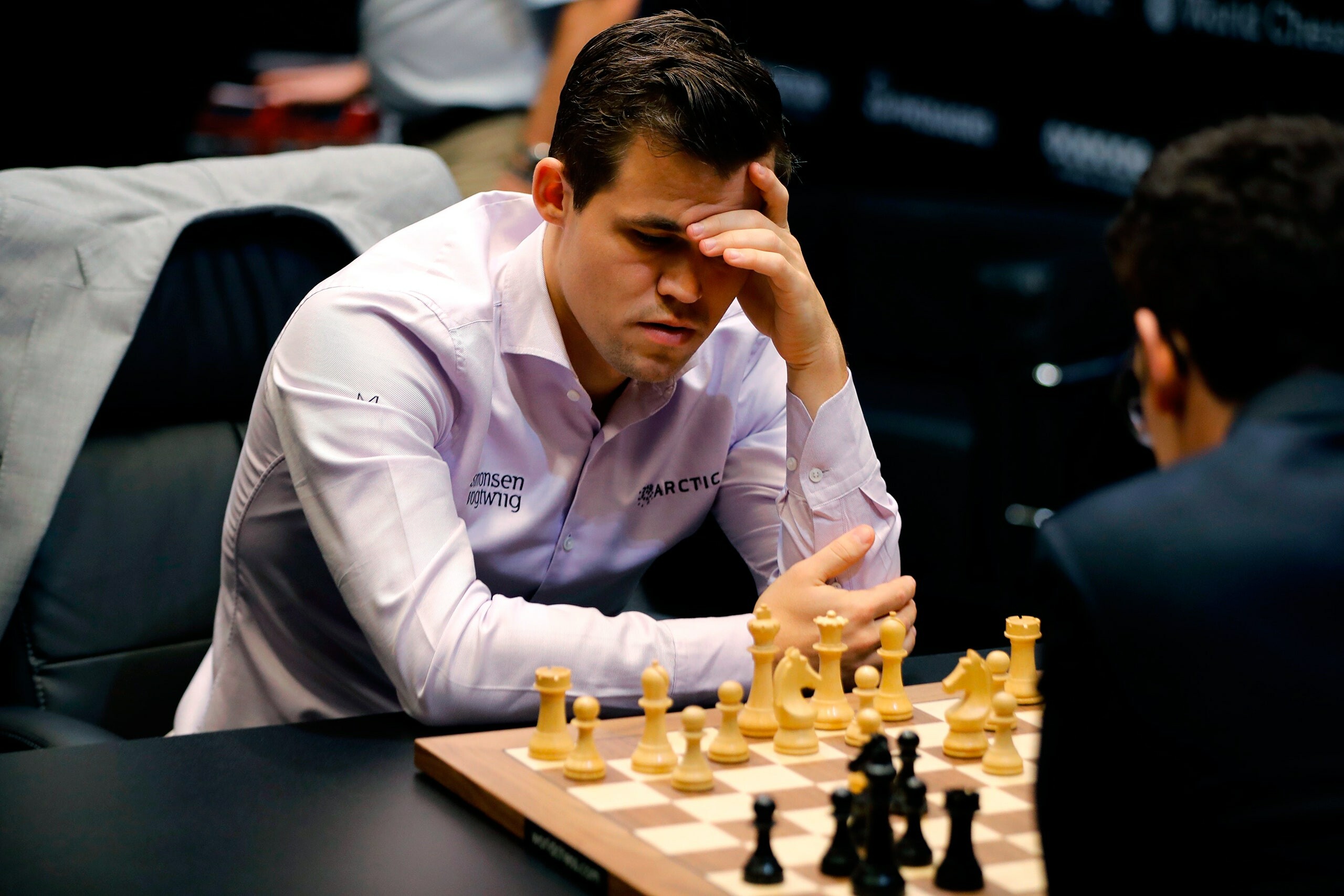 Magnus Carlsen: Four-time World Rapid Chess Champion and six-time World Blitz Chess Champion. 2560x1710 HD Background.