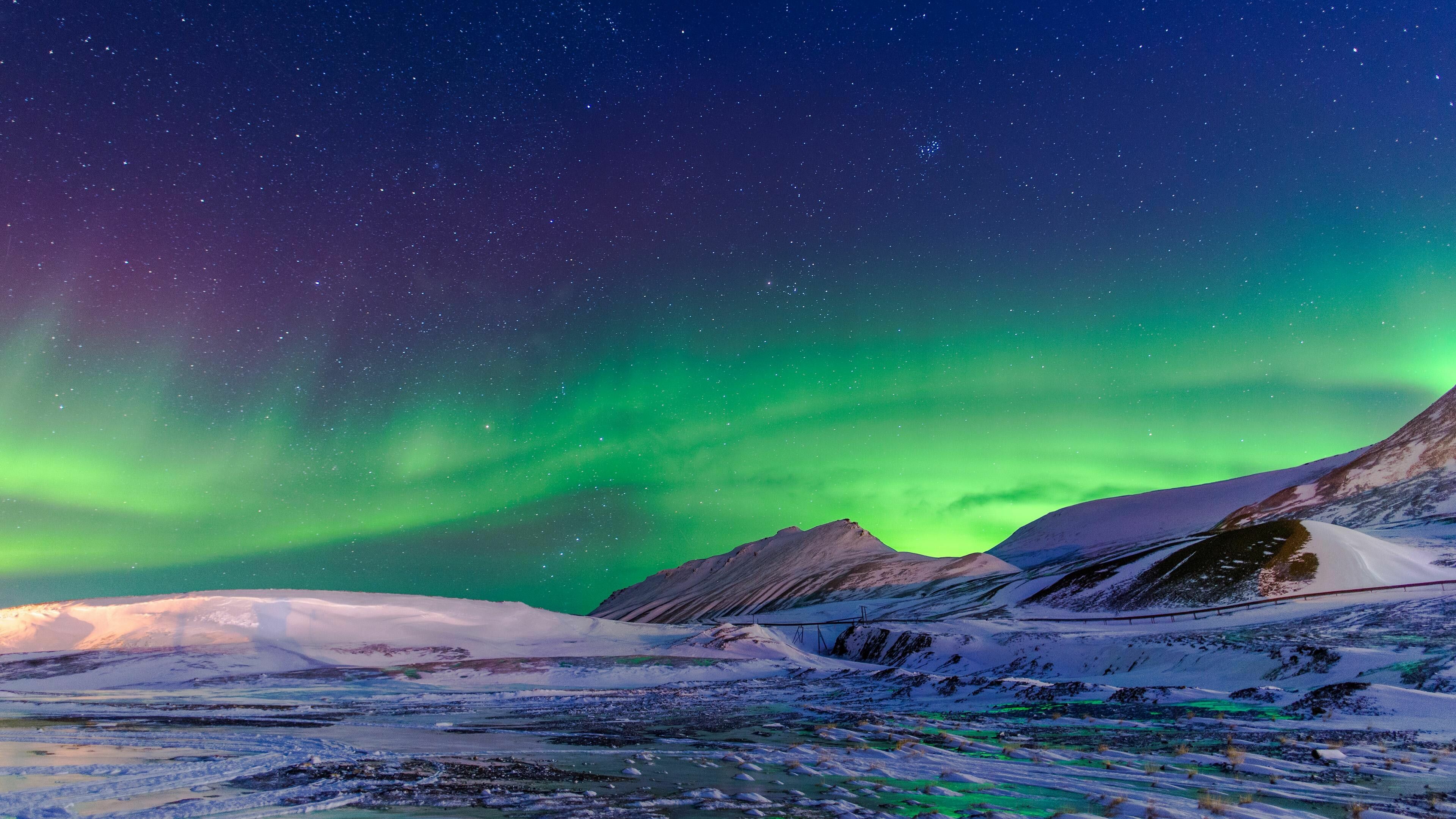 Aurora Borealis: Northern Lights, seen in the polar regions, within a radius of 2,500 km around the magnetic poles. 3840x2160 4K Background.