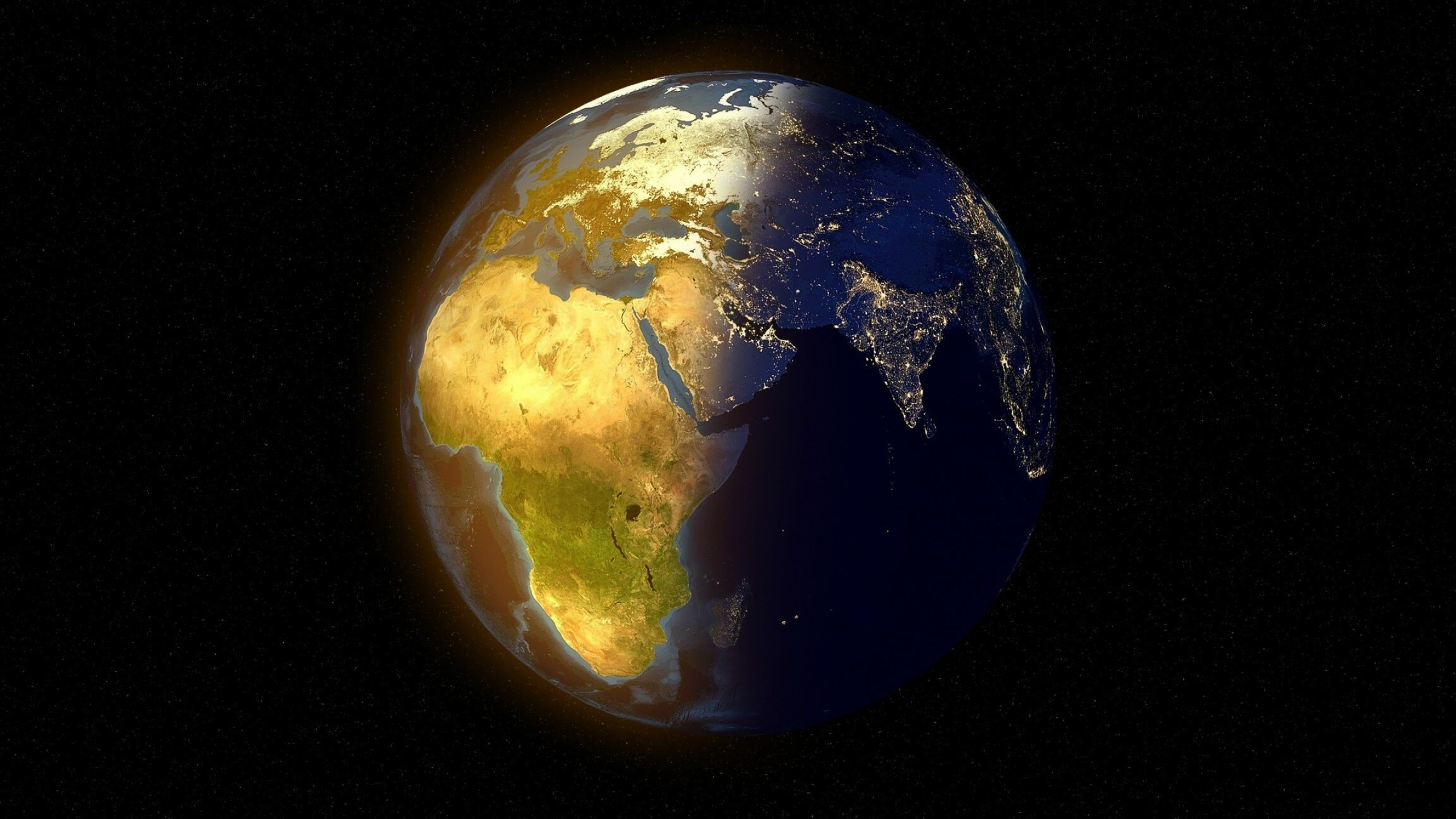 Earth at Night: Only planet that sustains liquid surface water, A terminator. 2560x1440 HD Background.