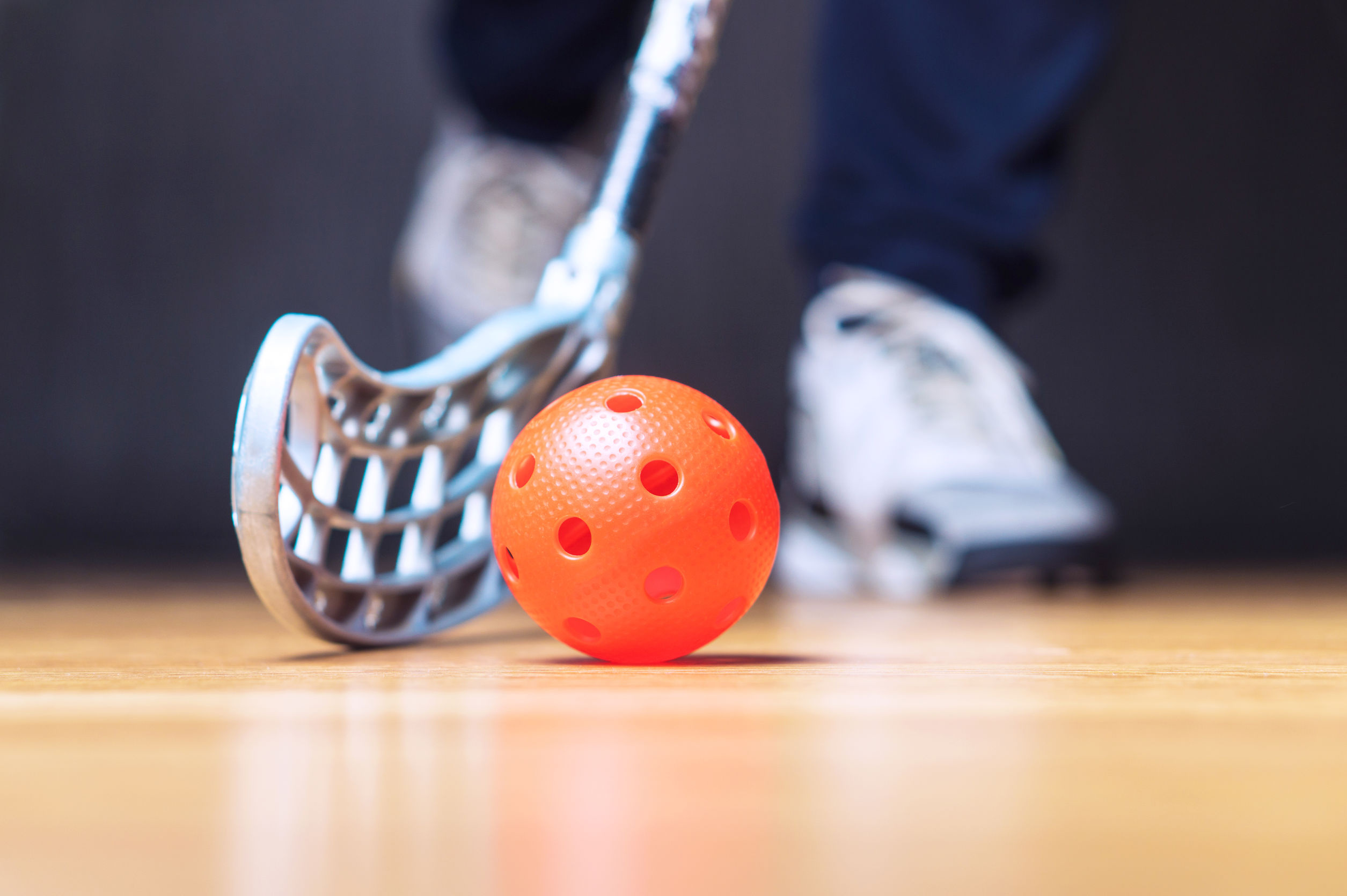 Floorball: A stick and a special ball with 26 holes in it, Equipment for a competitive sports discipline. 2510x1680 HD Background.