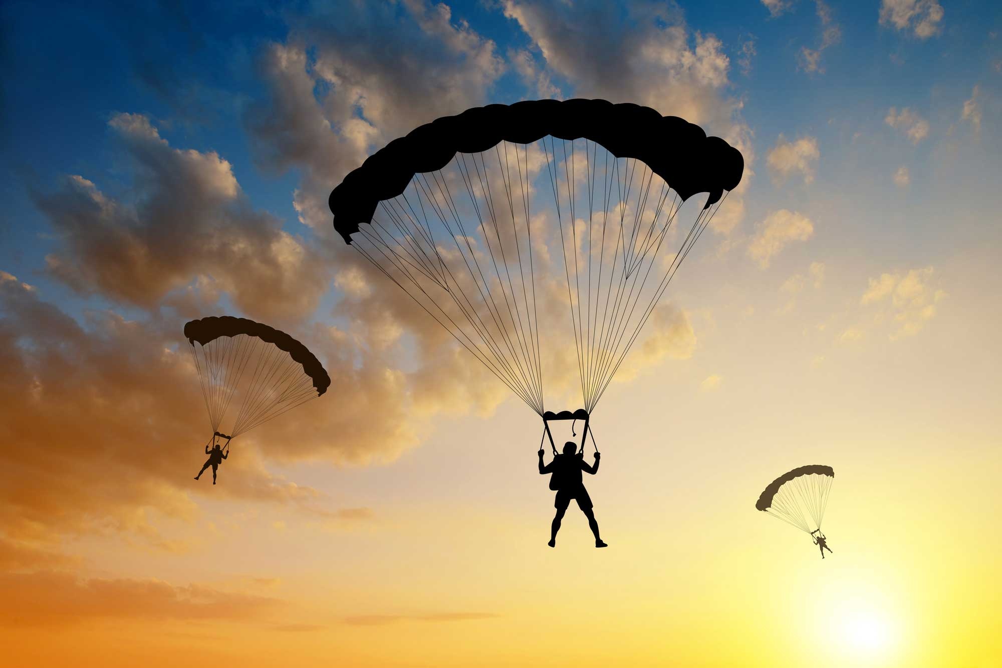 Parachuting: Successful parachute deployment, Jumping from an aircraft with a group. 2000x1340 HD Background.