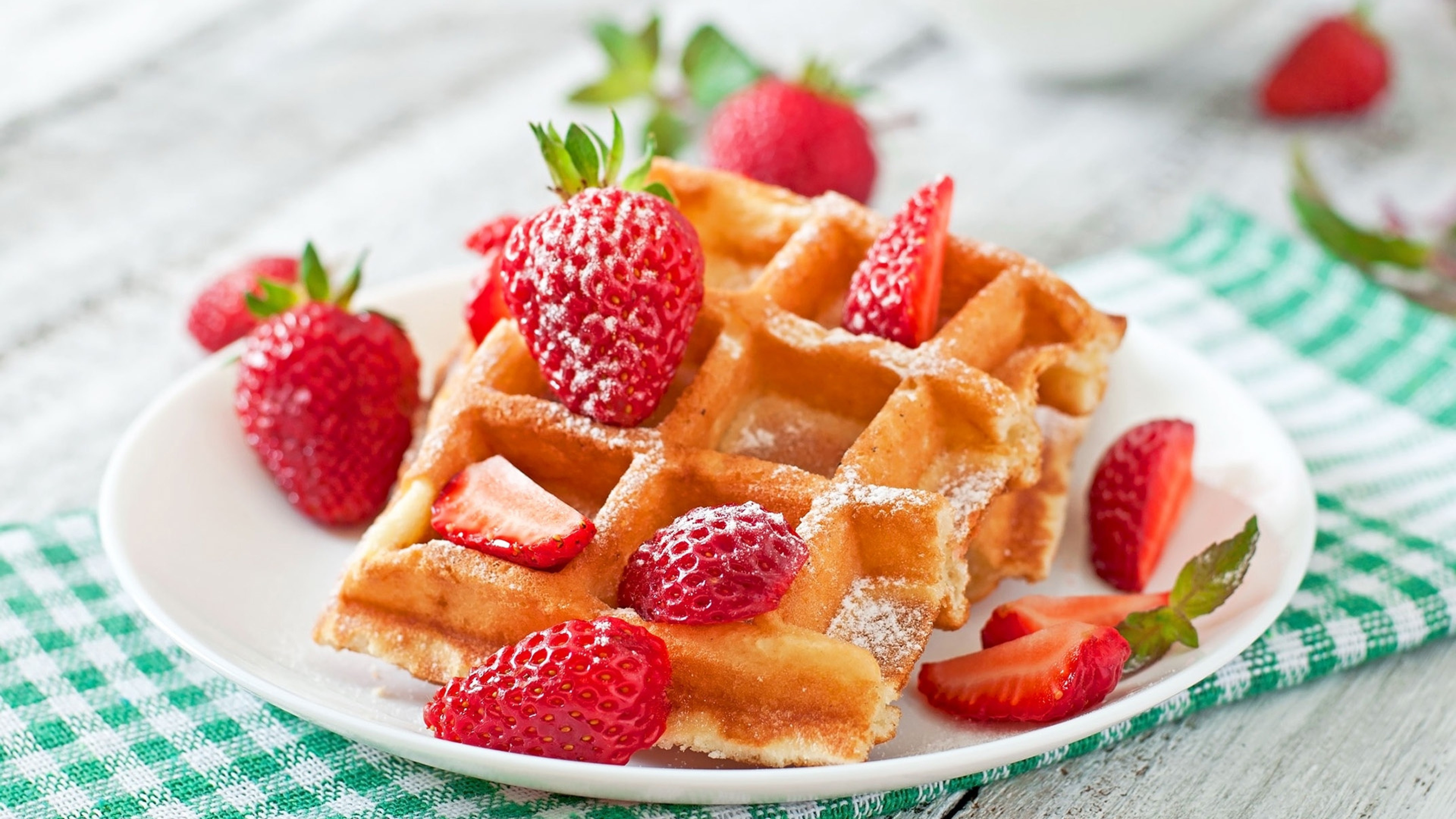 Waffle: A popular breakfast food, often topped with fruit preserves. 3840x2160 4K Background.