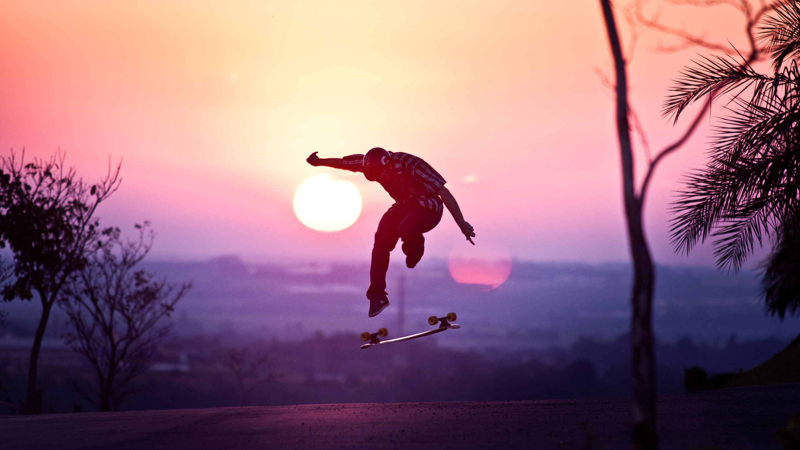 Skateboarding: Street action sport in the sunset, Recreational activity and extreme adventure sport. 2560x1440 HD Background.
