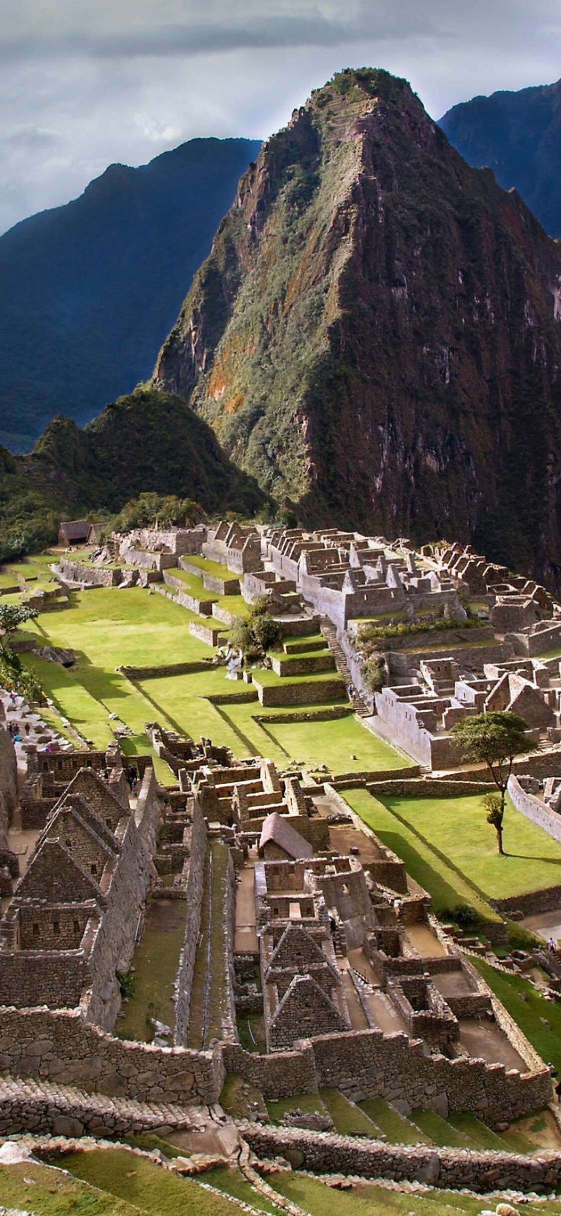 Machu Picchu: Site of ancient Inca ruins, Located about 80 km northwest of Cuzco. 1130x2440 HD Background.