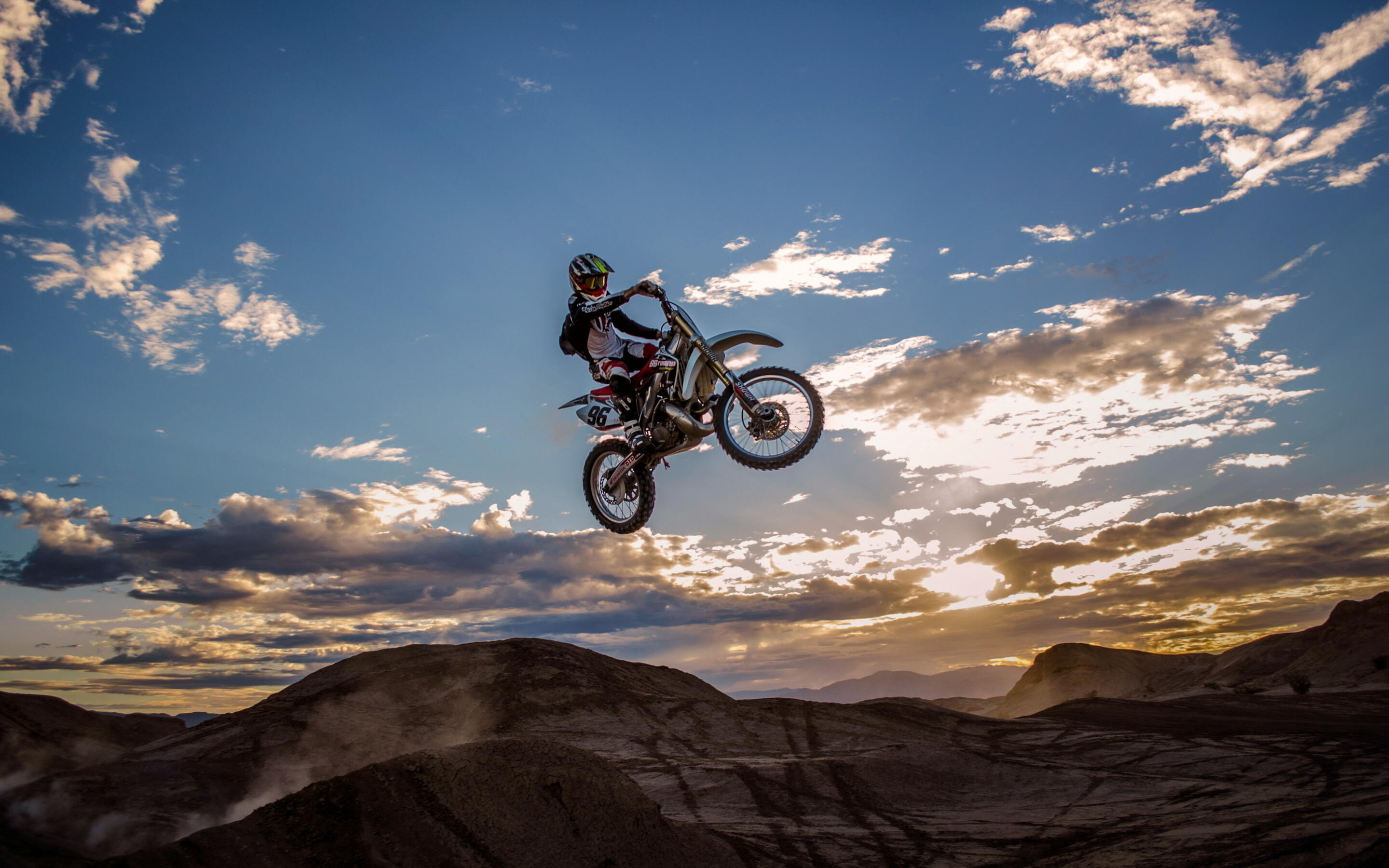 Stunt: Dirt bike stuntman, Enduro elements in the air. 2880x1800 HD Wallpaper.