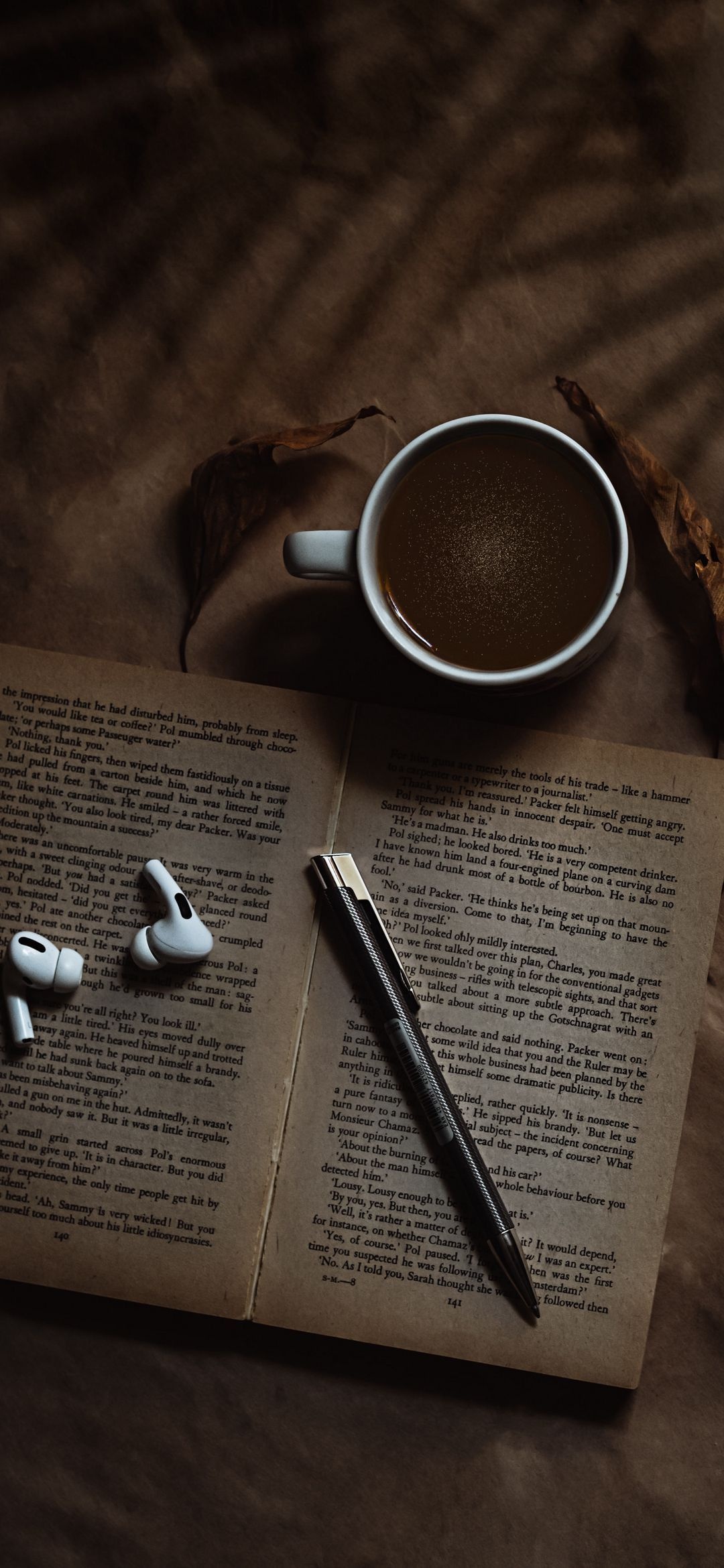 Caffeine-fueled reading, Coffee stains, Musical accompaniment, Book lovers' bliss, 1080x2340 HD Phone