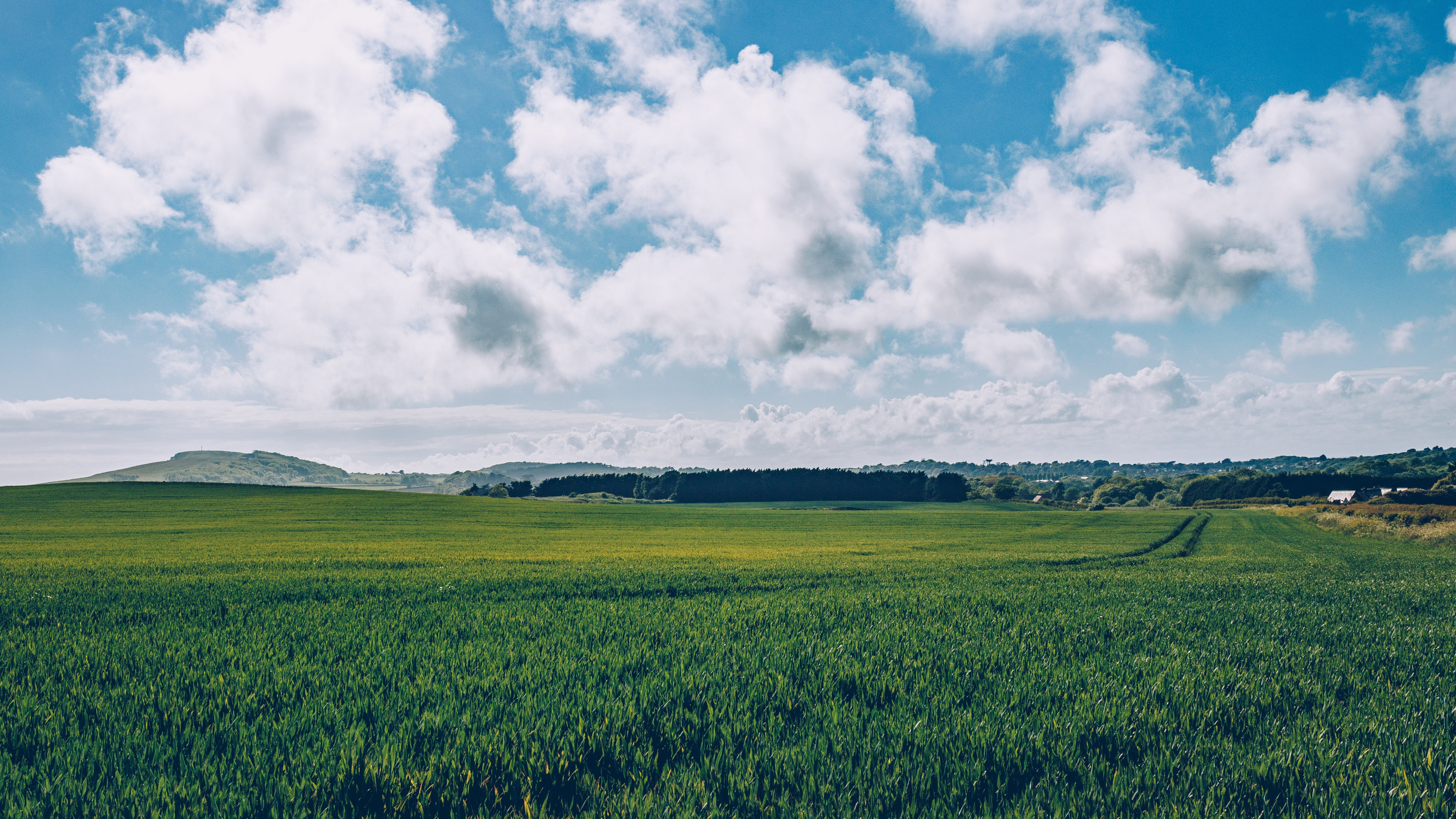 Grass and Sky: Green fields, Back roads, Clouds, Countryside, Environment, Land, Non-urban area. 3840x2160 4K Wallpaper.
