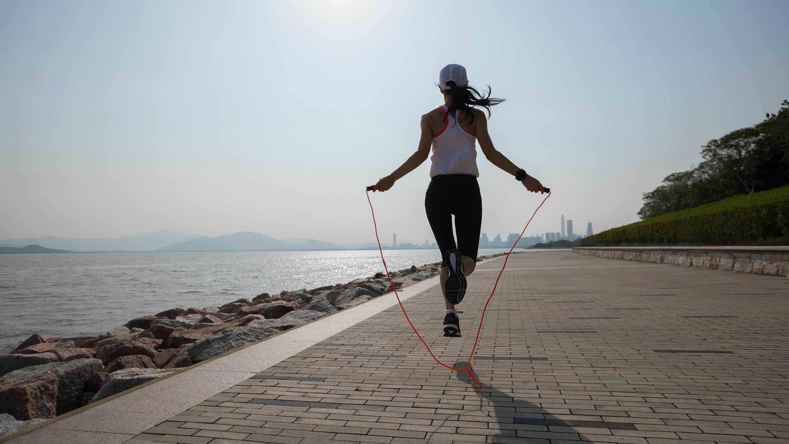 Rope Jumping: Double jump, Outdoor workout, Outdoor fitness. 2560x1440 HD Background.
