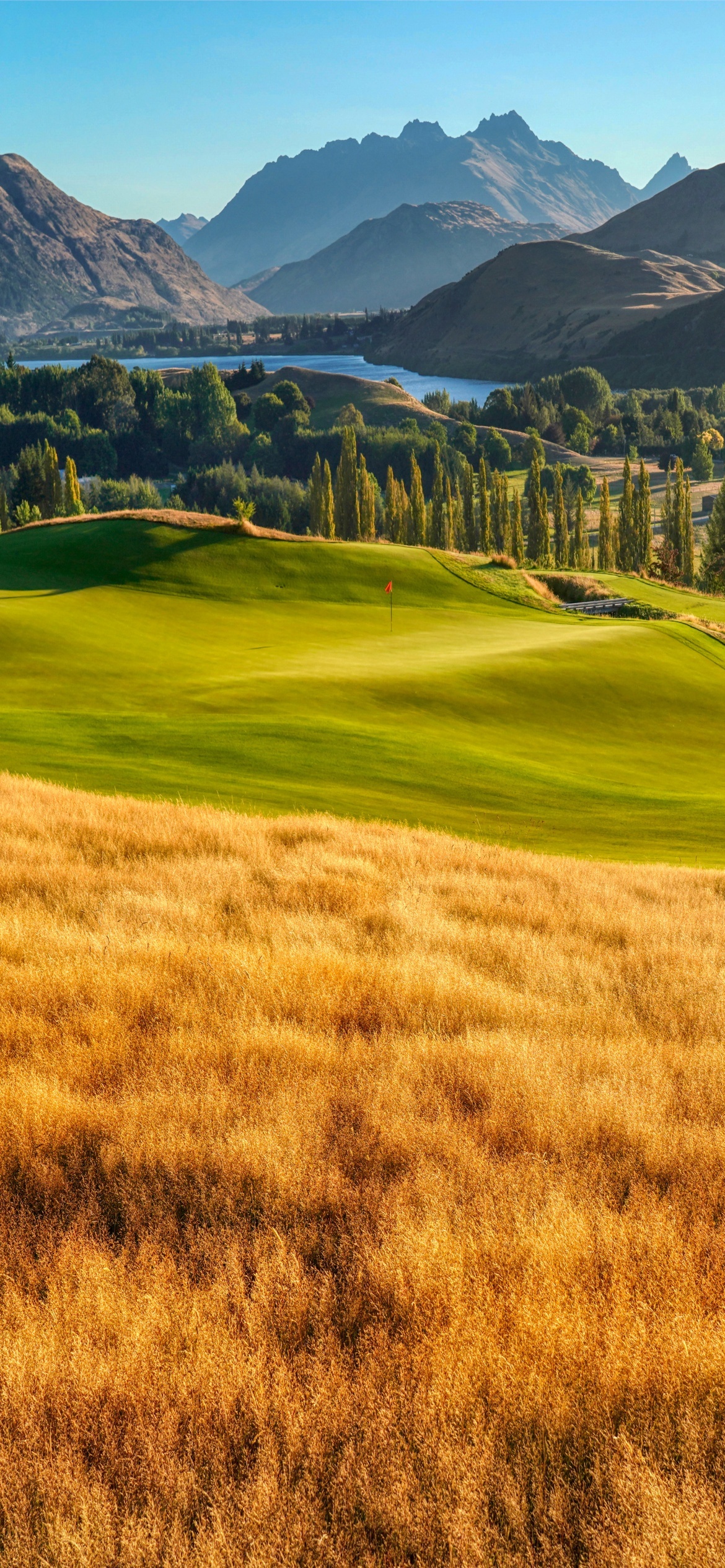 Golf Course: Landscape, Mountains, Lake, Par 3, Green, Nature, Tifway 419, Green, Meadow. 1170x2540 HD Background.