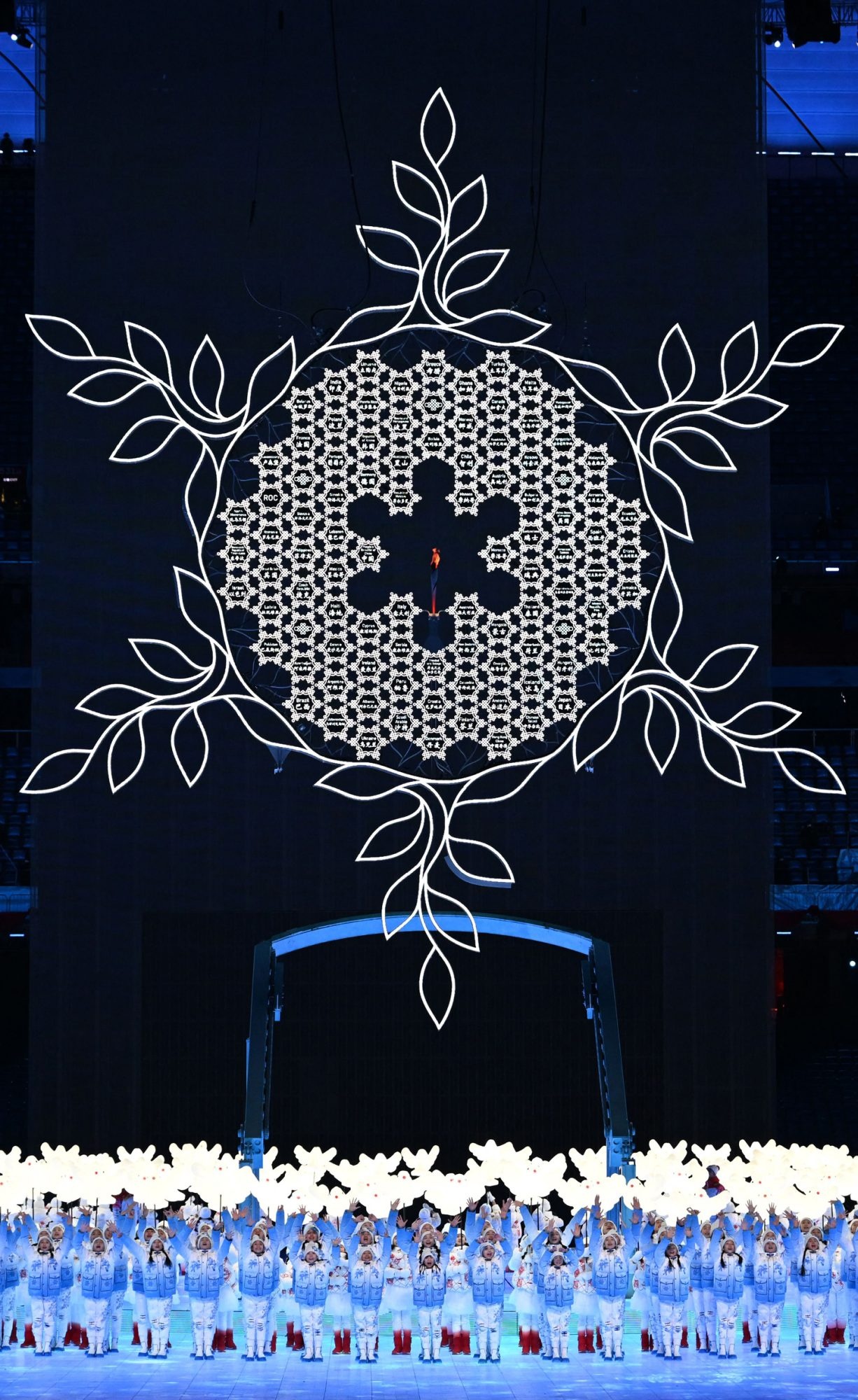 Olympic Flame: Beijing Opening Ceremony, A snowflake made up of the names of all participating nations. 1230x2000 HD Wallpaper.
