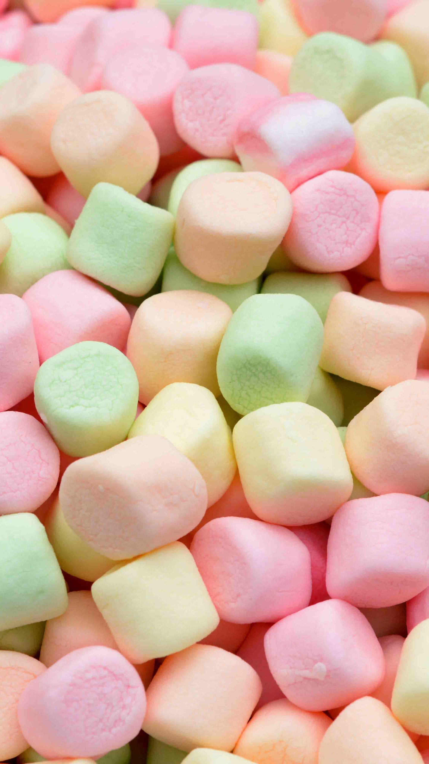 Marshmallow: Made from corn syrup, dextrose, gelatin, and egg albumen. 1440x2560 HD Background.
