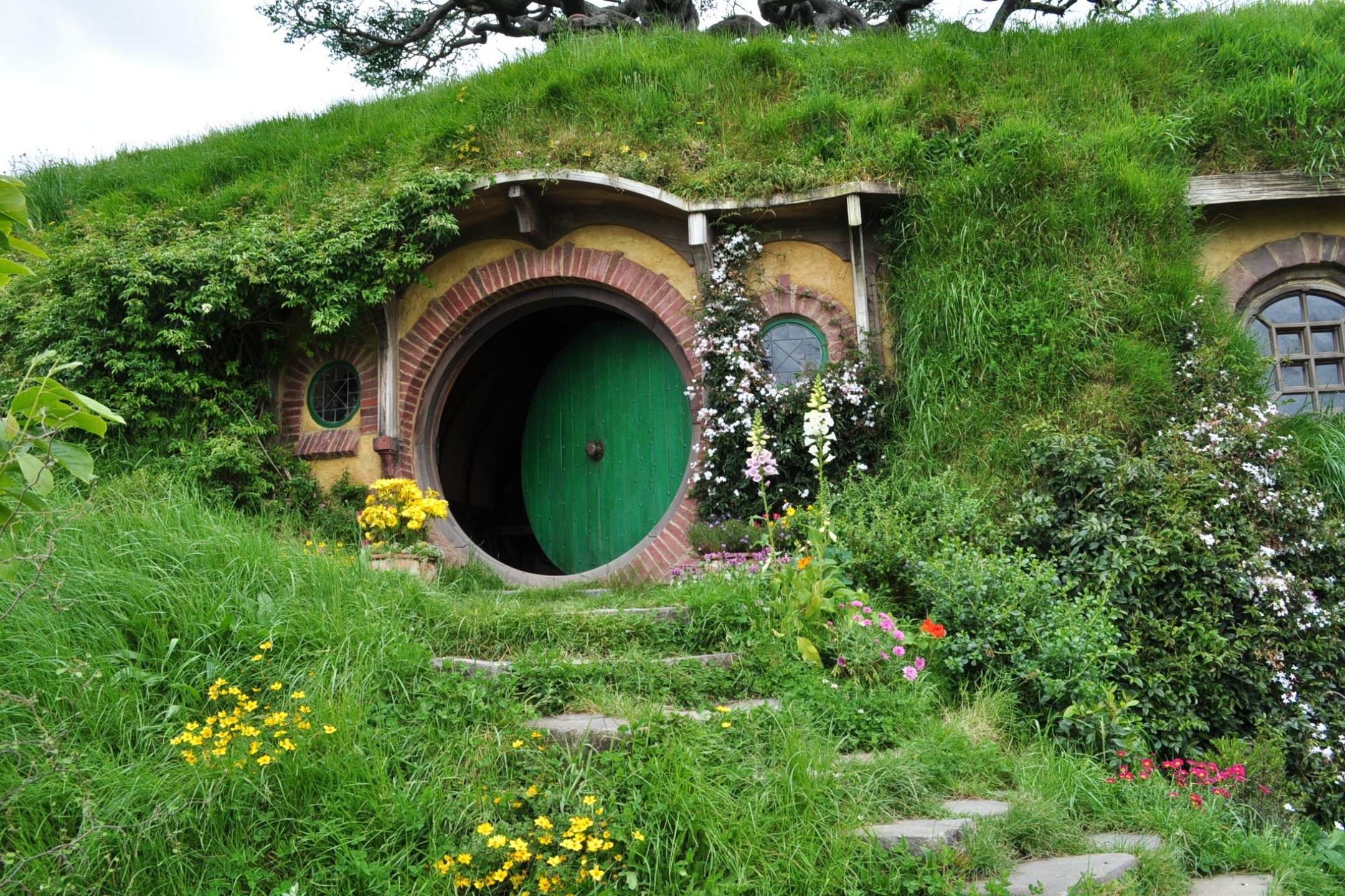 Man-made Hobbiton, Captivating landscape, Unique architecture, Fantasy world, 2160x1440 HD Desktop