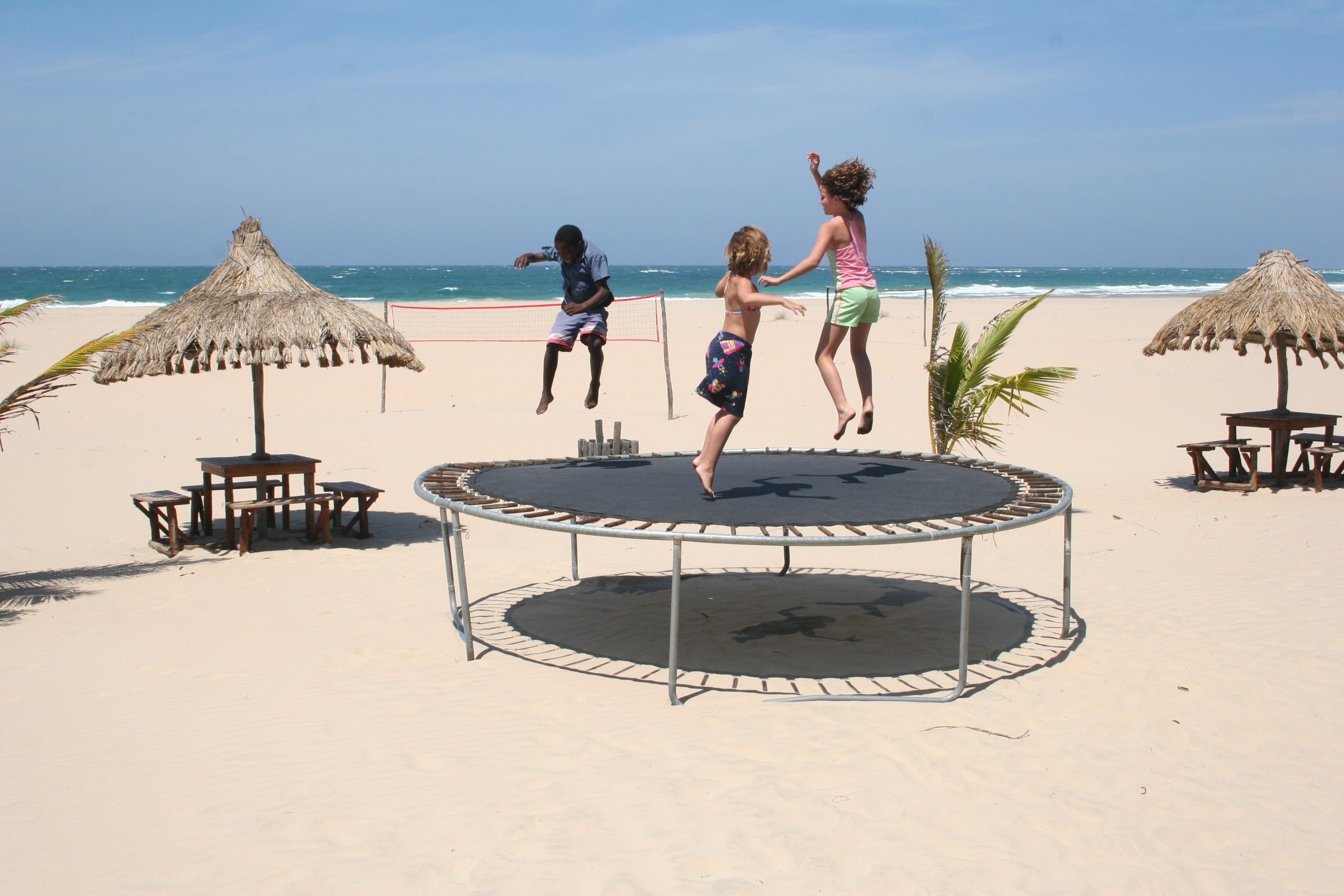 Trampolining: A group of children having pleasure while jumping on a beach trampoline, A family sport. 2550x1700 HD Wallpaper.