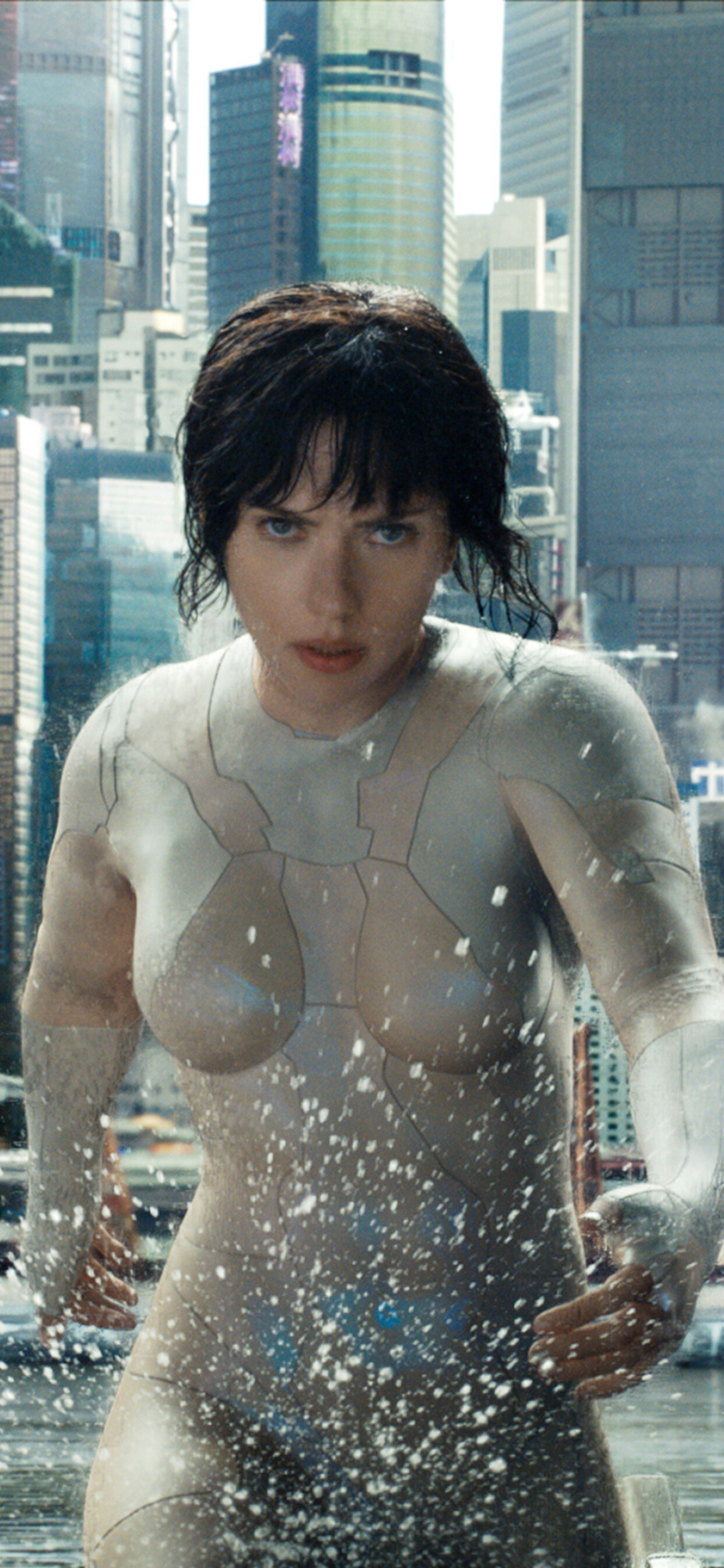 Ghost in the Shell (Movie): Scarlett Johansson as Mira Killian, Strong-willed, physically powerful, and highly intelligent operative. 1250x2690 HD Background.