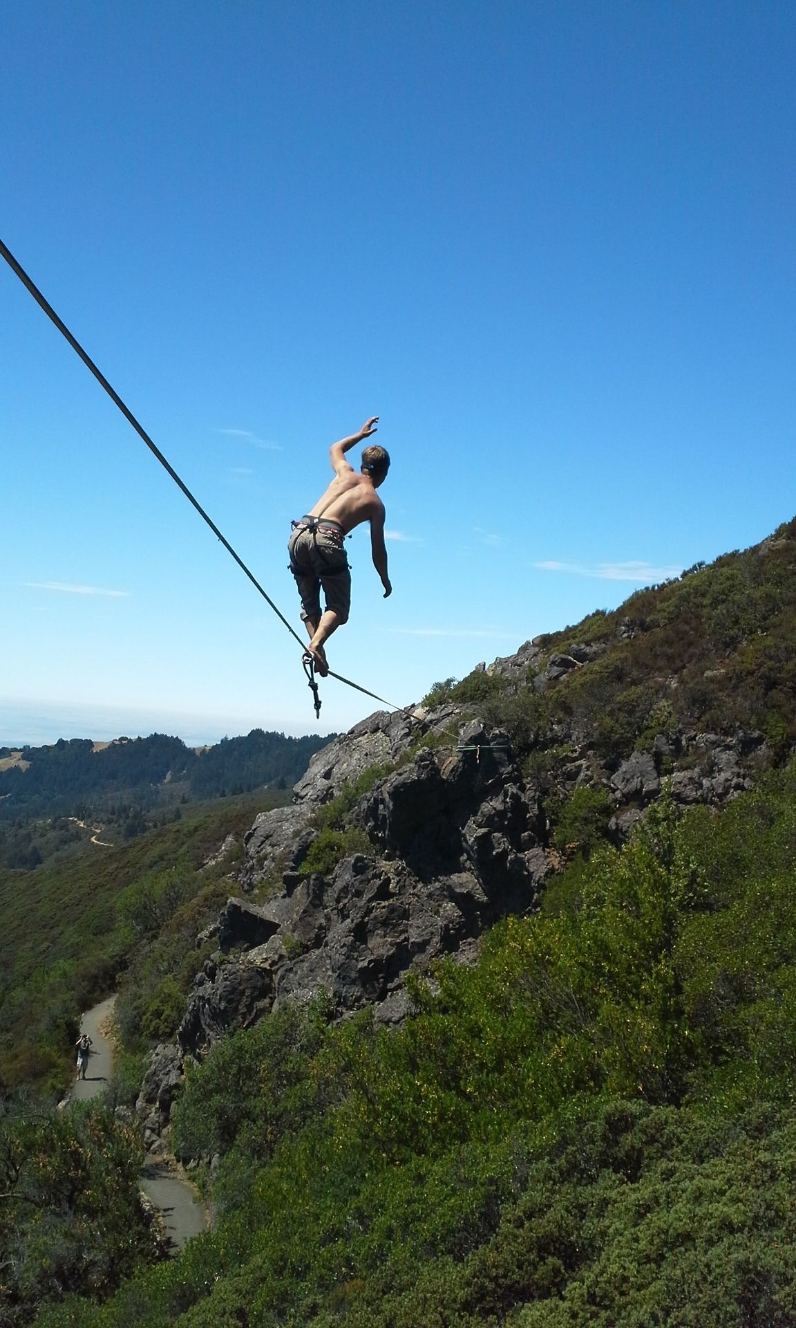 Slacklining: Taking a walk above the mountain, Focusing on your abilities, Balance training. 1160x1920 HD Background.