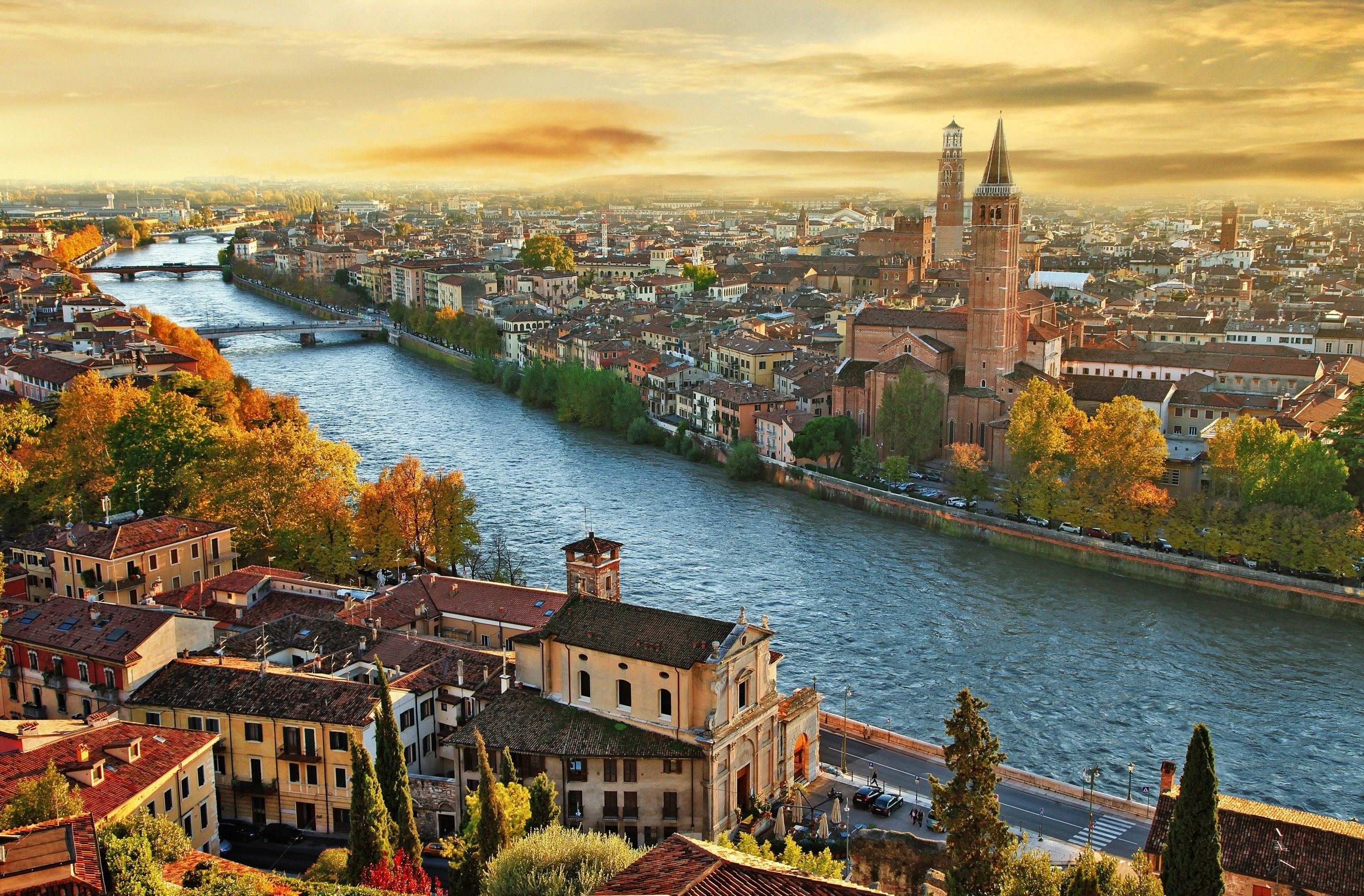 Cityscape: A view of the Adige river and the medieval Catholic church in Verona from Castel San Pietro, Italy. 3000x1970 HD Wallpaper.