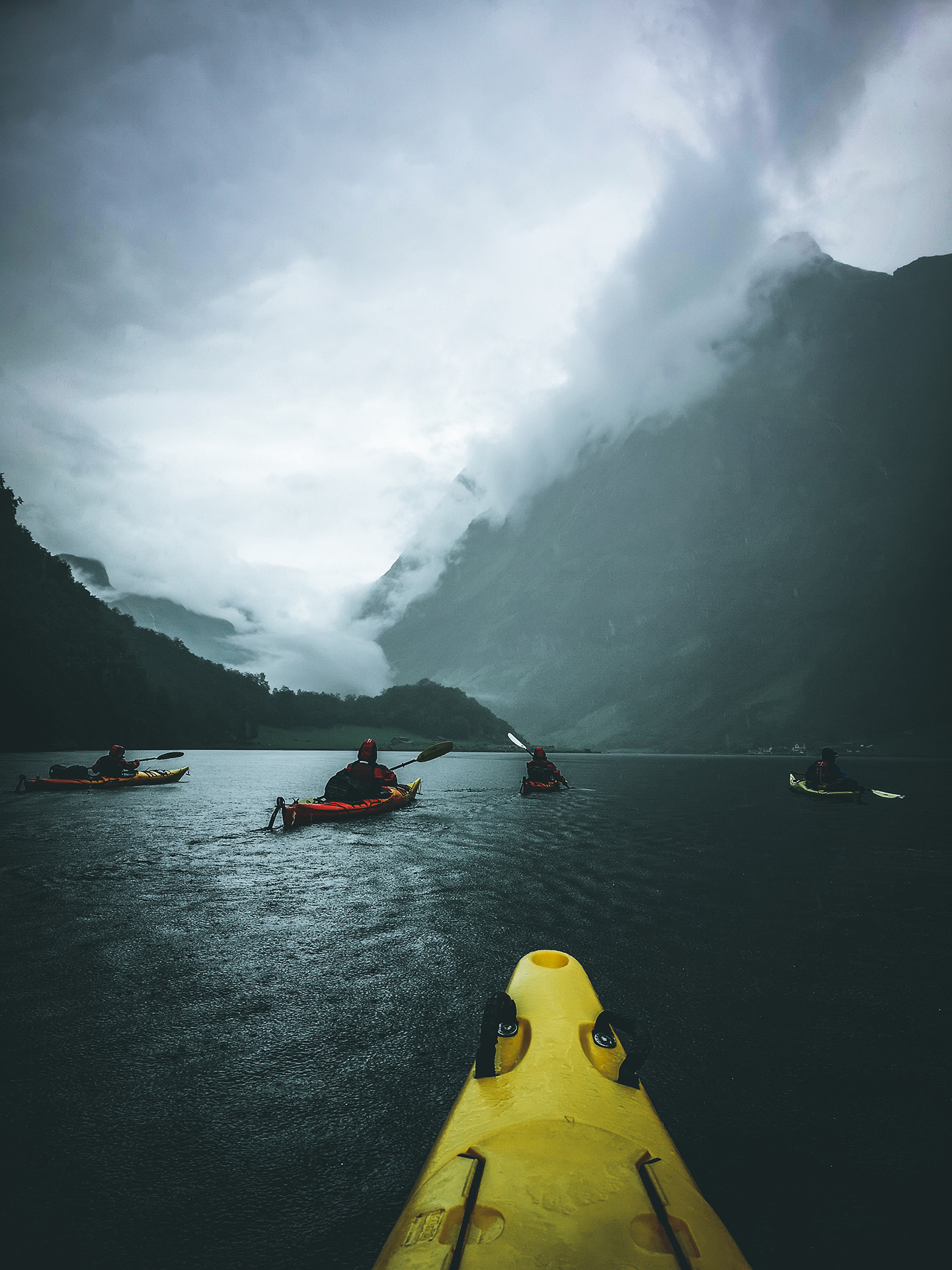 Kayaking: An extended water trip to the far side of a mountain lake. 1440x1920 HD Background.