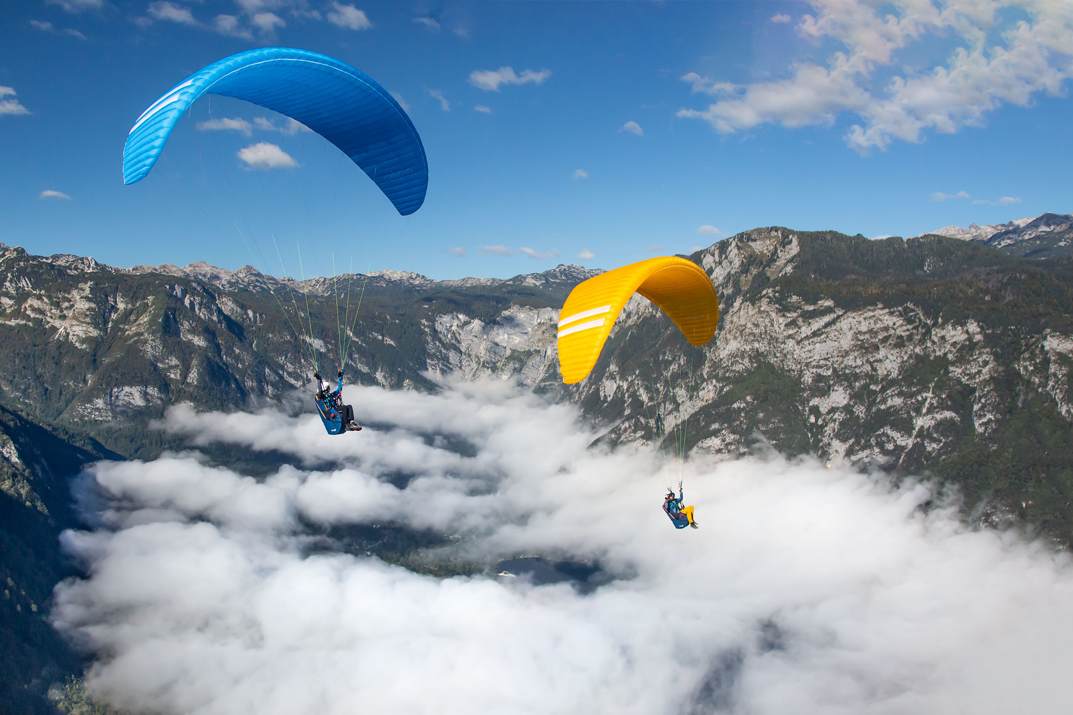 Paragliding: Austria flying school, Flying paragliders in the mountains season 2022. 2100x1400 HD Background.