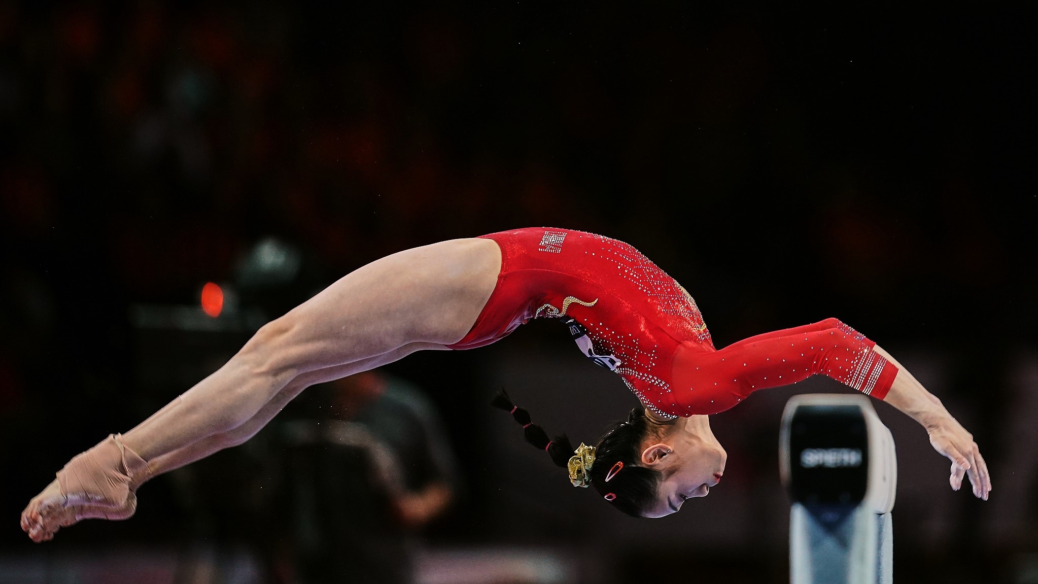 Balance Beam: Tang Xijing of China during the competition for women at the 49th FIG Artistic Gymnastics World Championships. 2050x1160 HD Background.