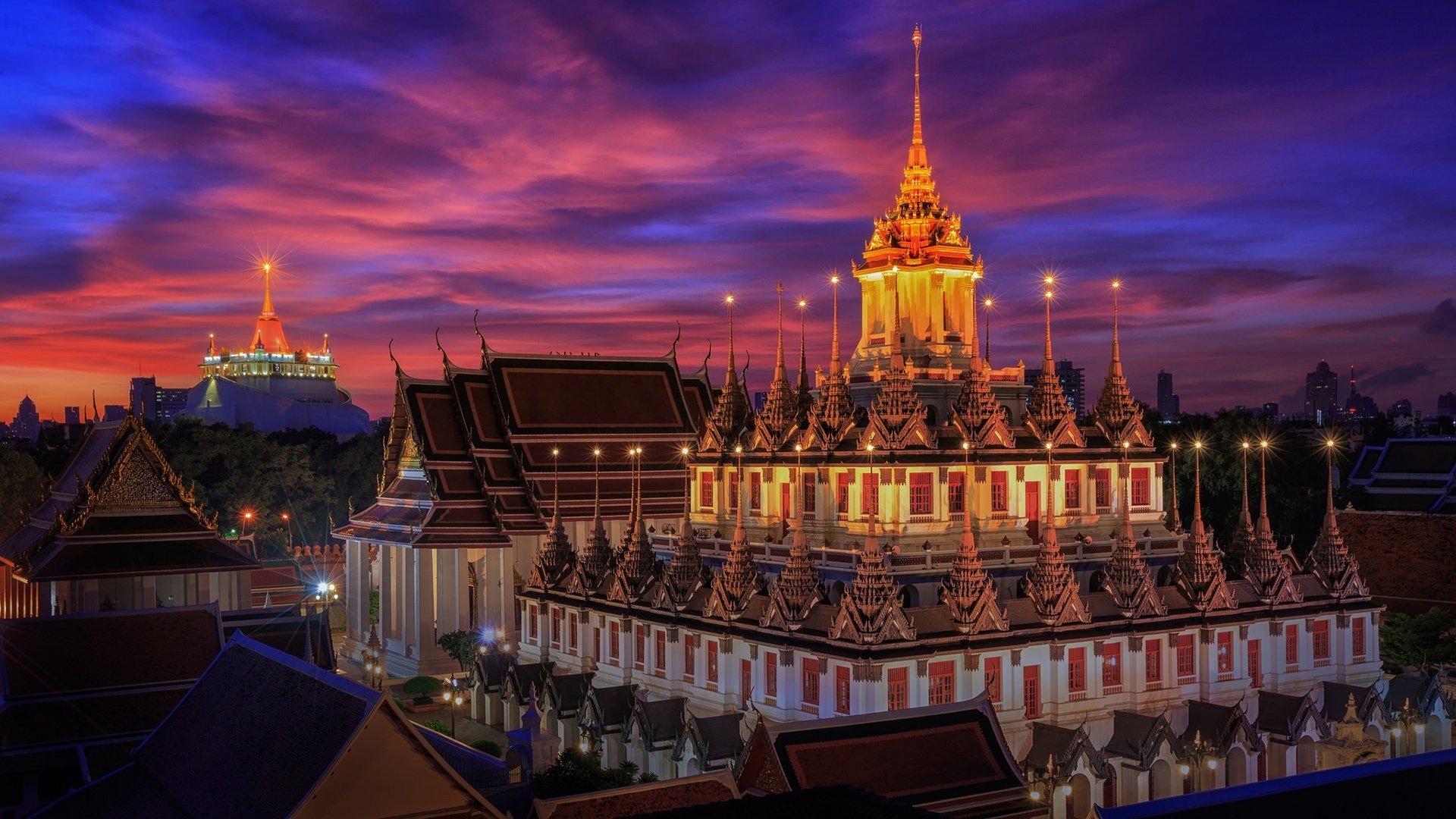 Bangkok: Wat Ratchanatdaram, Located at the intersection between Ratchadamnoen Klang and Maha Chai Road, in Phra Nakhon district. 1920x1080 Full HD Background.
