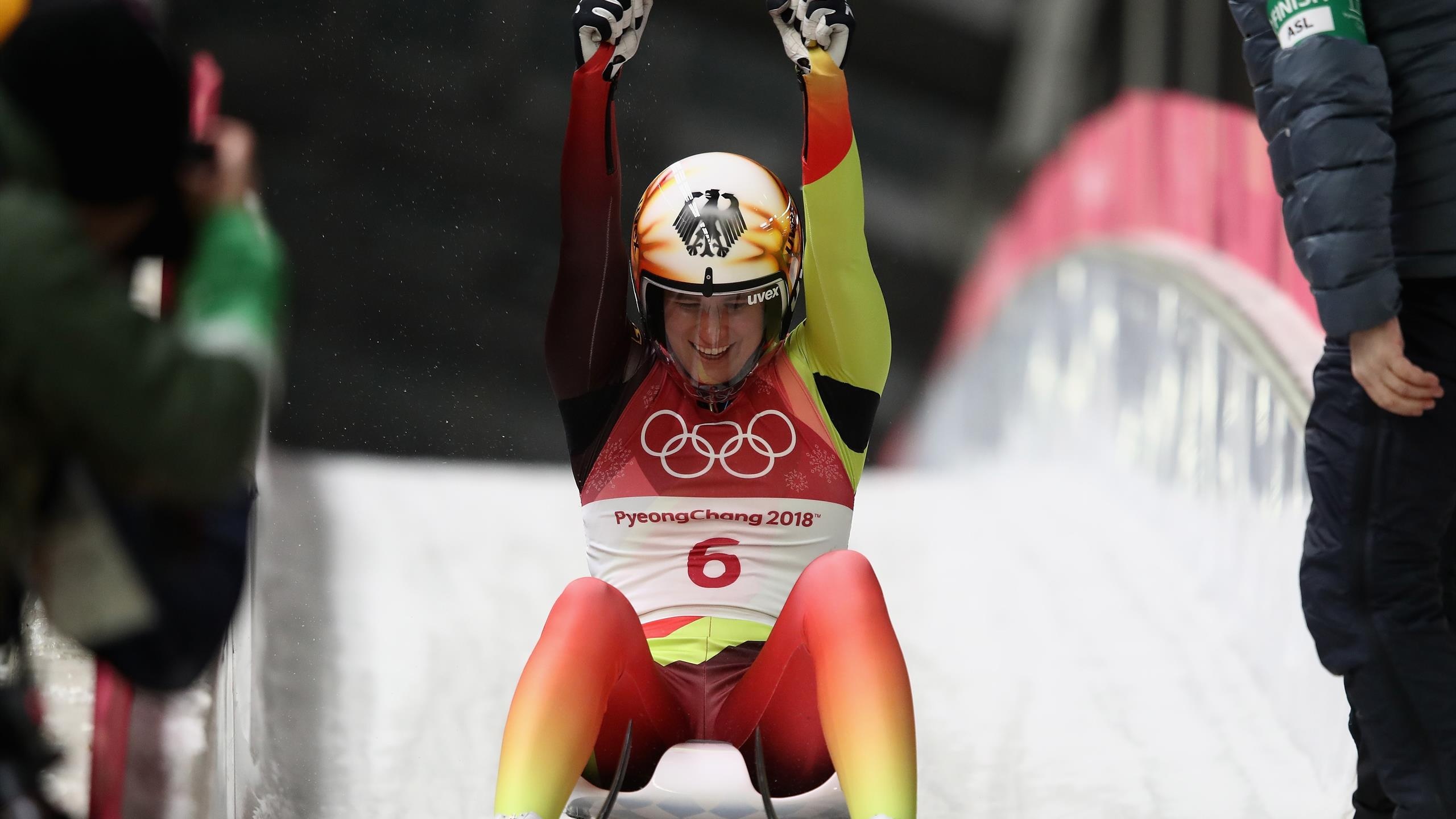 Luge: A German luger celebrates after finishing at the 2018 PyeongChang Winter Olympics. 2560x1440 HD Background.