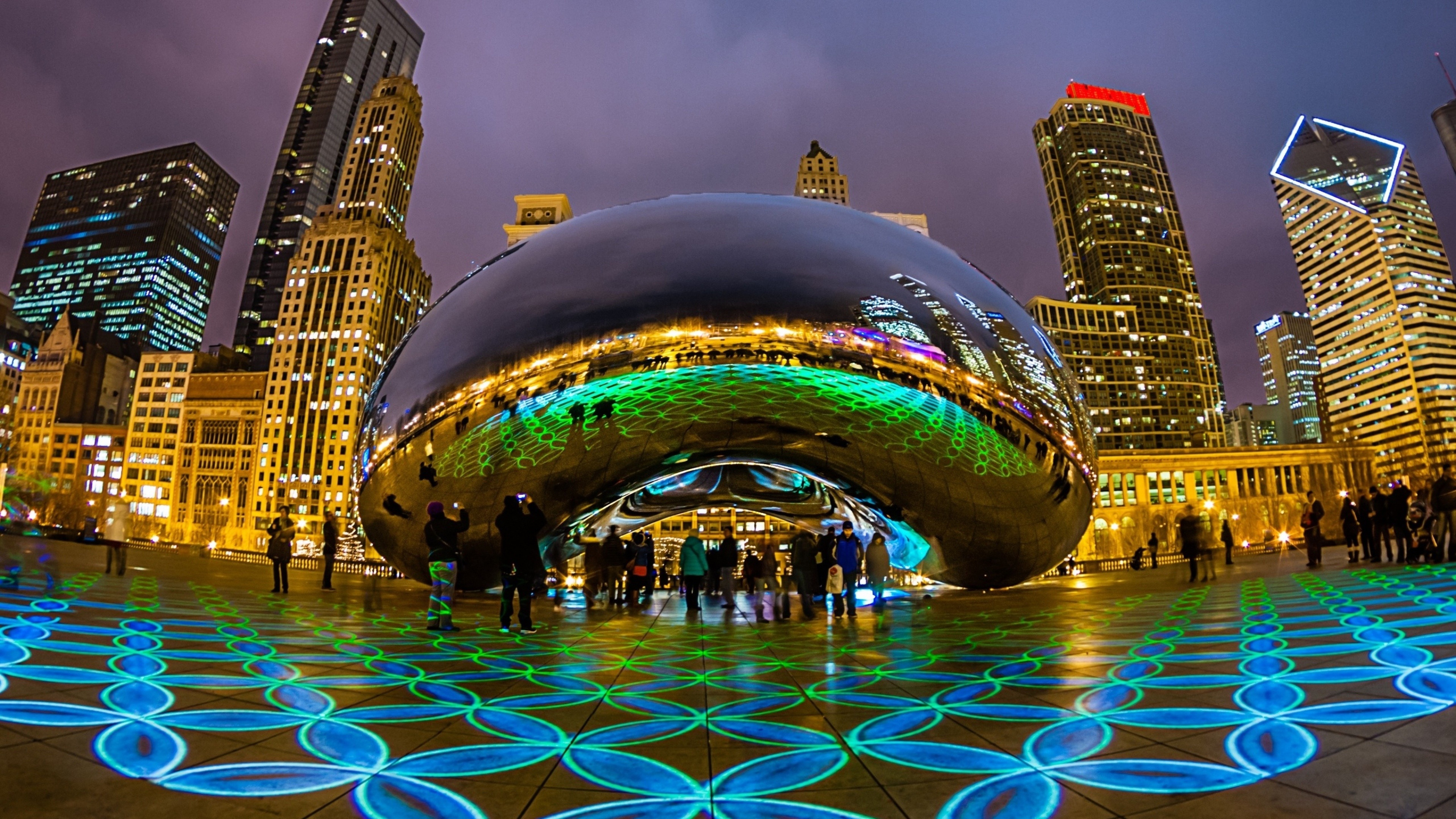 Chicago: Cloud Gate, The centerpiece of AT and T Plaza, Skyscrapers. 3840x2160 4K Background.