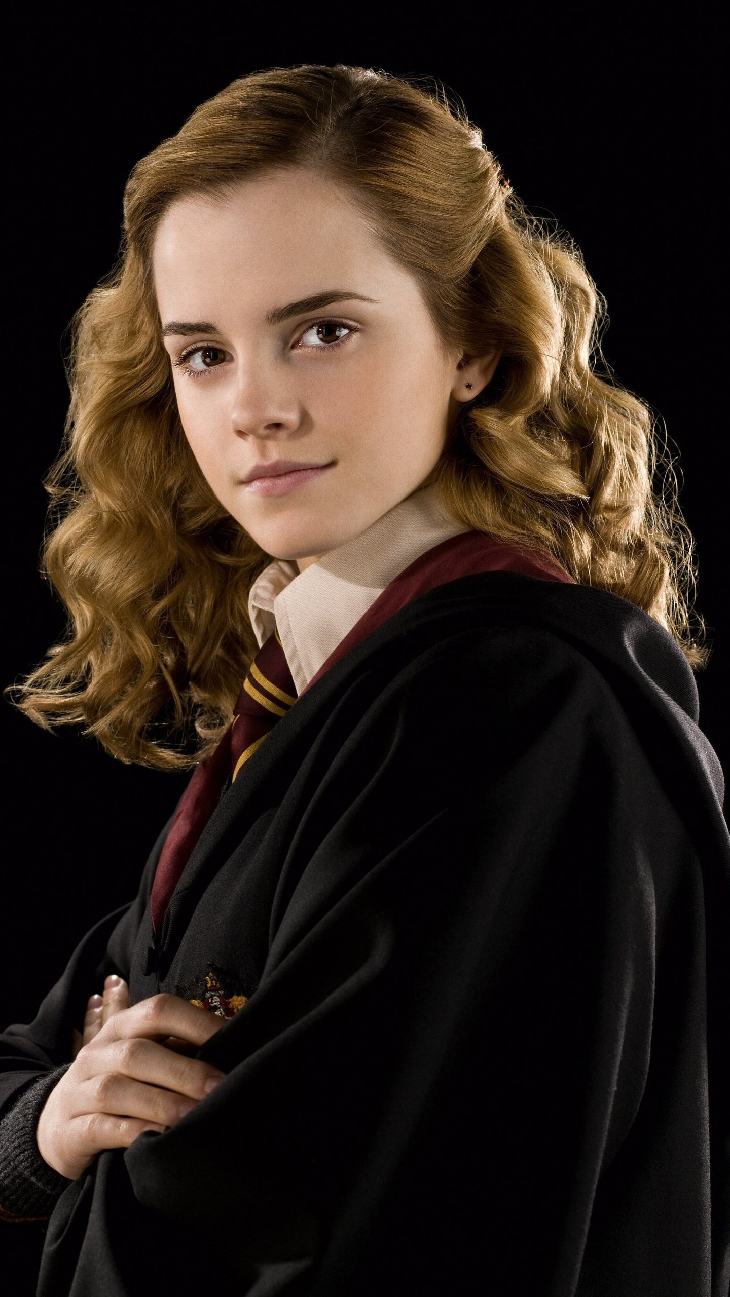 Hermione: A Muggle-born Gryffindor, who becomes best friends with Harry Potter and Ron Weasley. 1440x2560 HD Background.