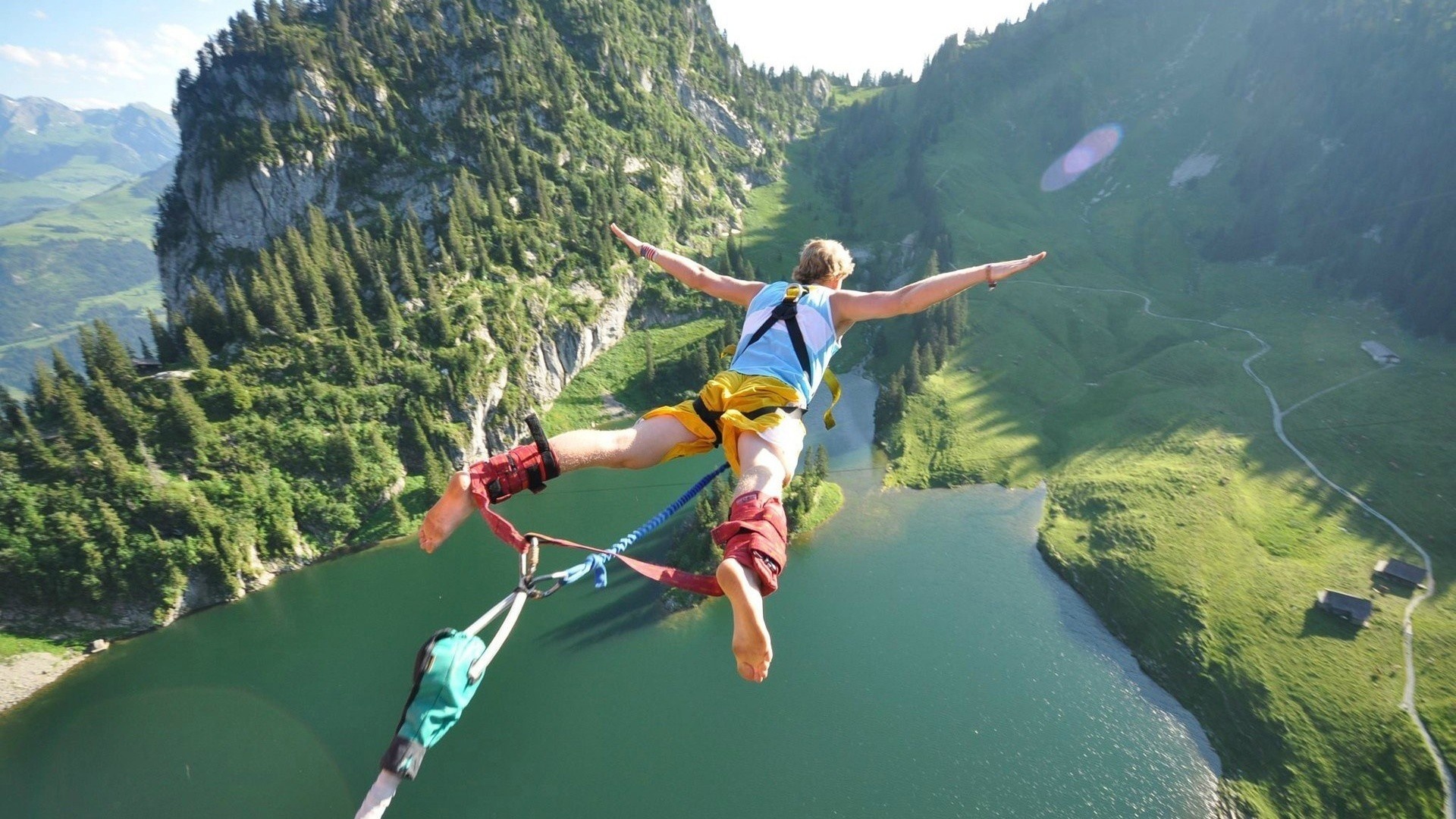 Air Sports: Extreme sports, A man goes bungee jumping, A free-fall, Switzerland. 1920x1080 Full HD Background.
