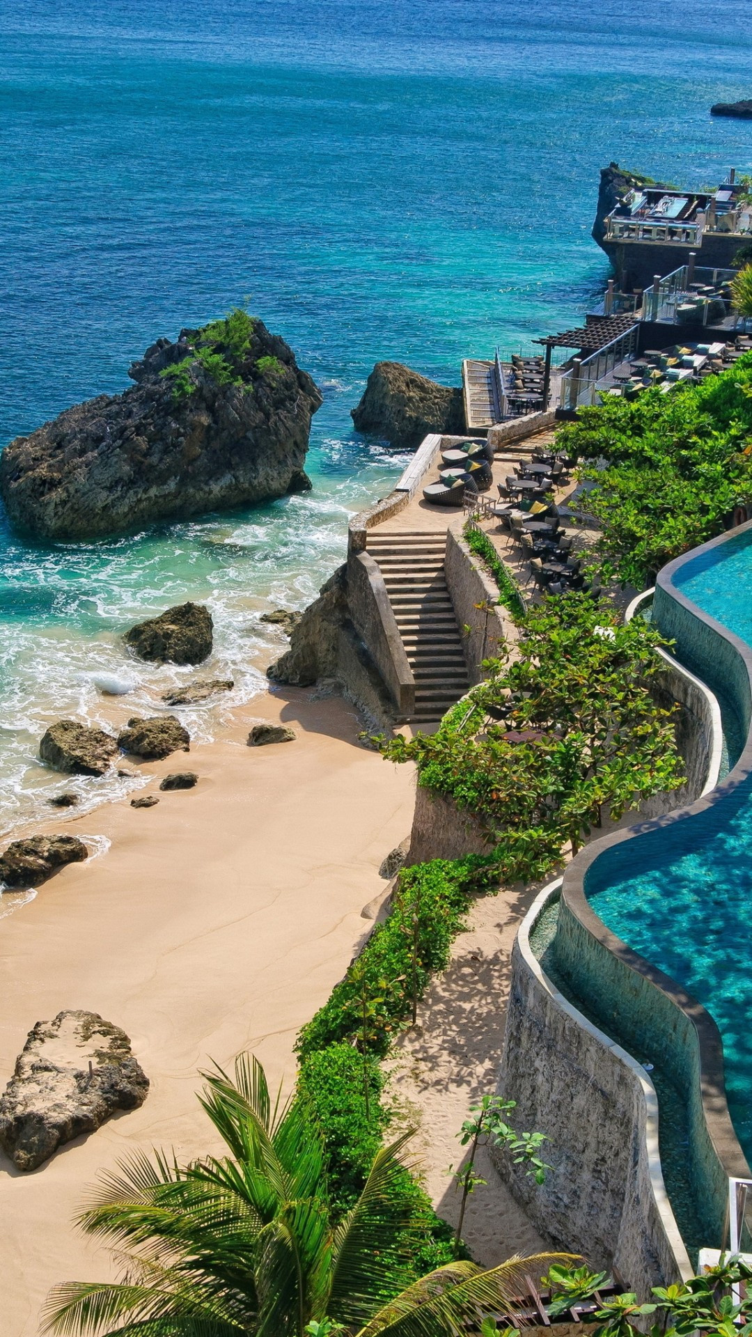 Bali's holiday retreats, Rocky poolside, Tropical wallpapers, Relaxing atmosphere, 1080x1920 Full HD Phone