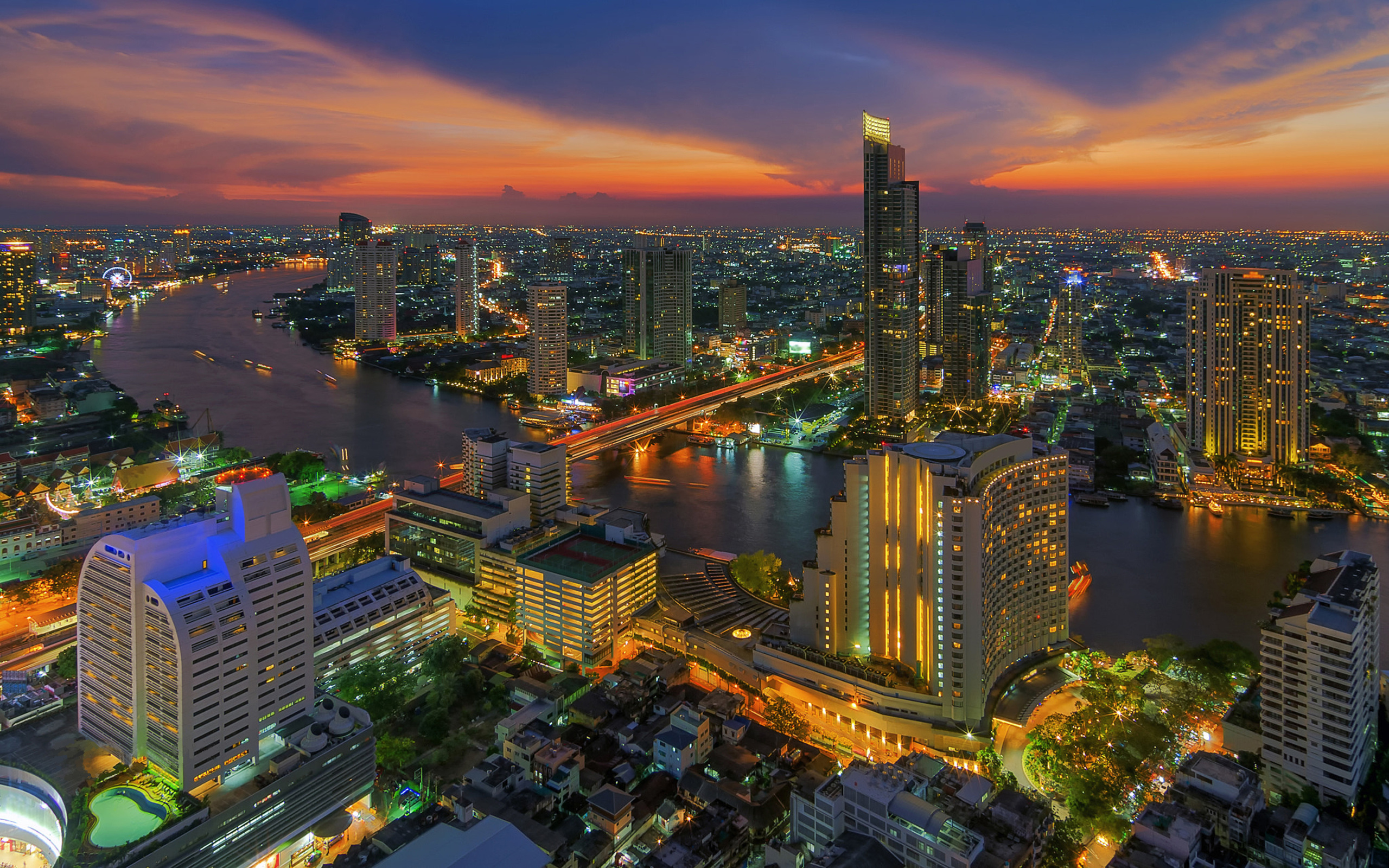 Bangkok: One of Asia's most cosmopolitan cities with magnificent temples and palaces, authentic canals, busy markets, and a vibrant nightlife that has something for everyone. 2560x1600 HD Background.