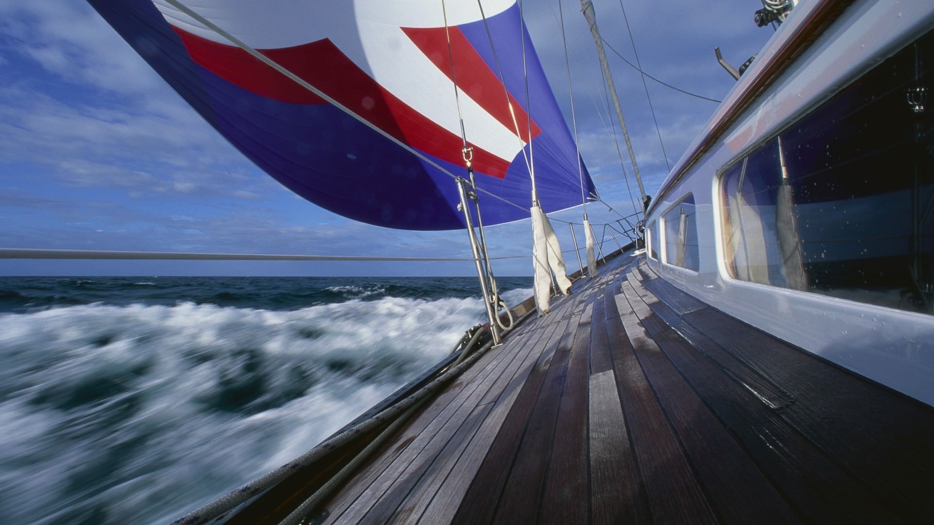 Sailing: The activity of riding in a boat that is propelled by the wind, A water sport. 1920x1080 Full HD Background.
