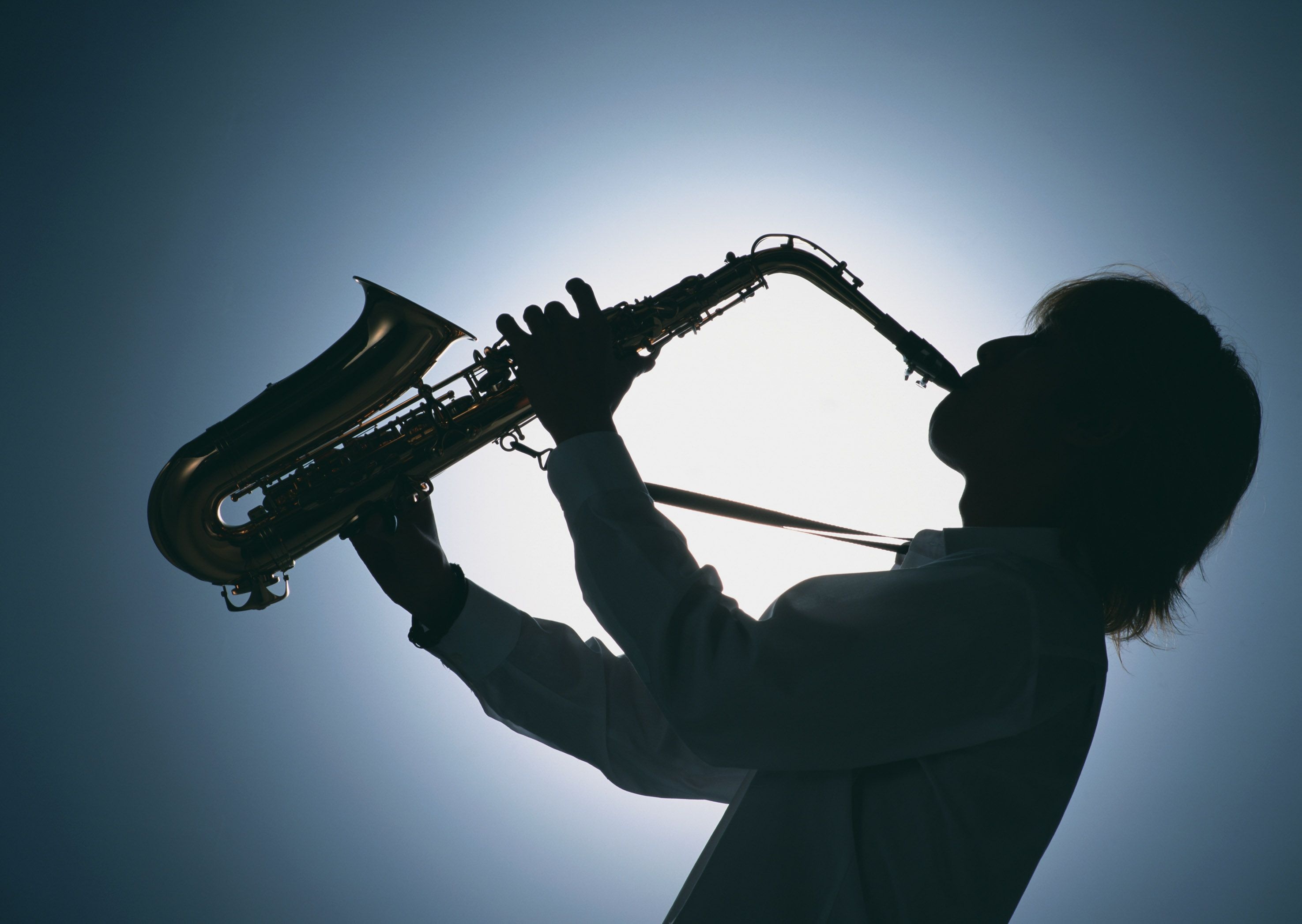 Saxophone: A keyed wind instrument with a conical bore and a single reed, A woodwind instrument. 2950x2100 HD Background.