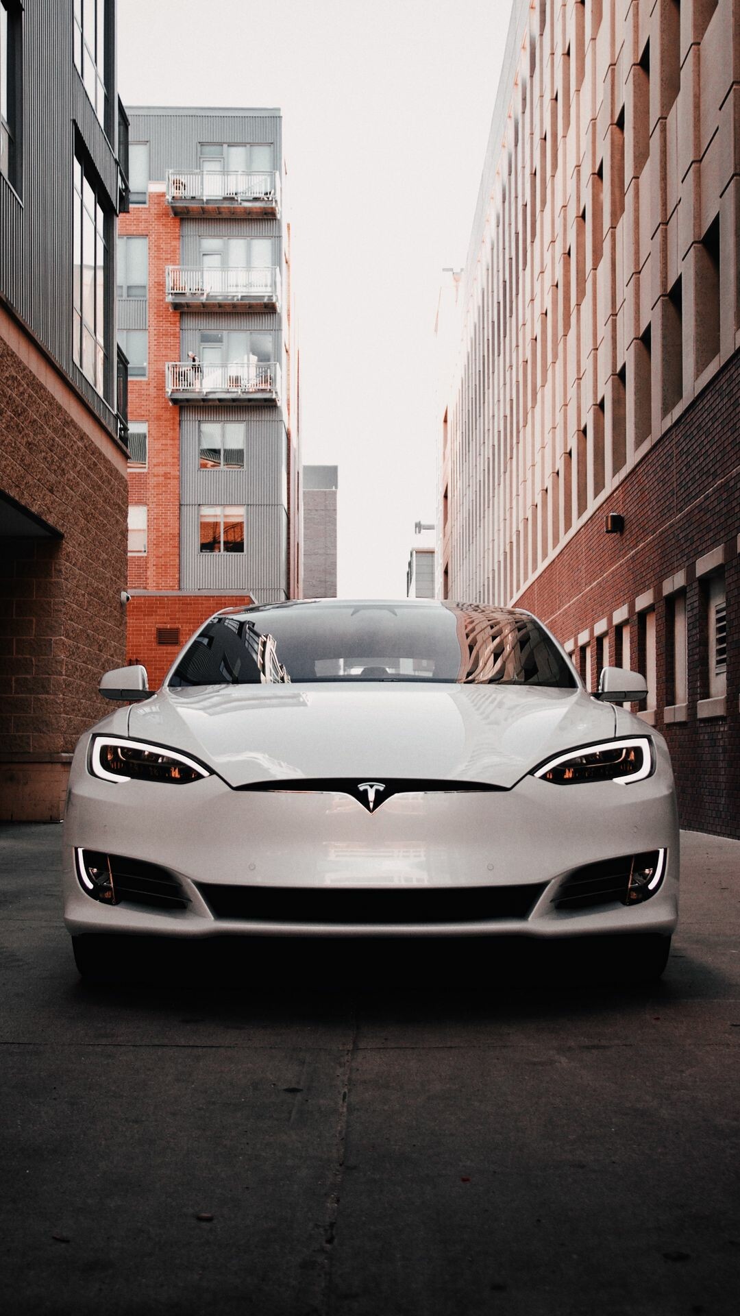 Tesla Model S: An electric fastback midsized luxury sedan with a high-tech minimalist cabin. 1080x1920 Full HD Background.
