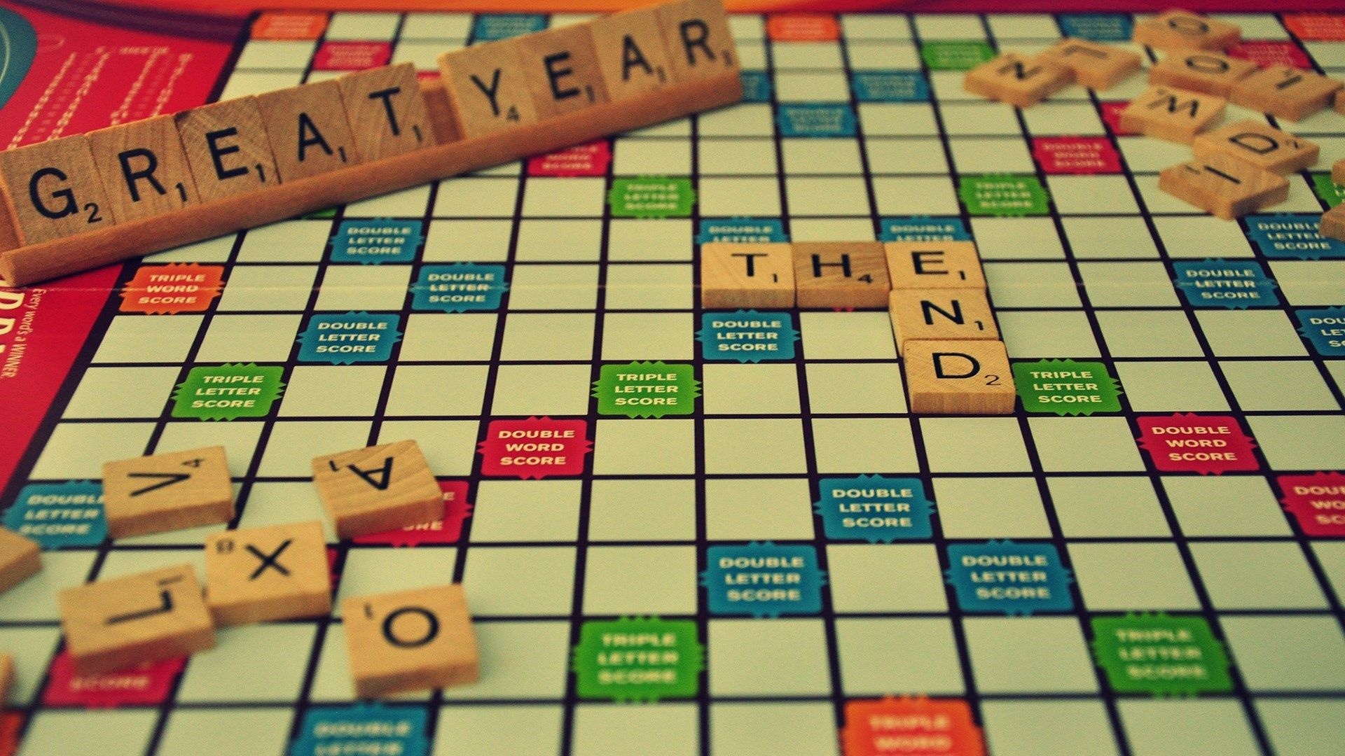 Scrabble: The end of a great year - a phrase spelled out in a board game on New Year's Eve, Mind games. 1920x1080 Full HD Background.