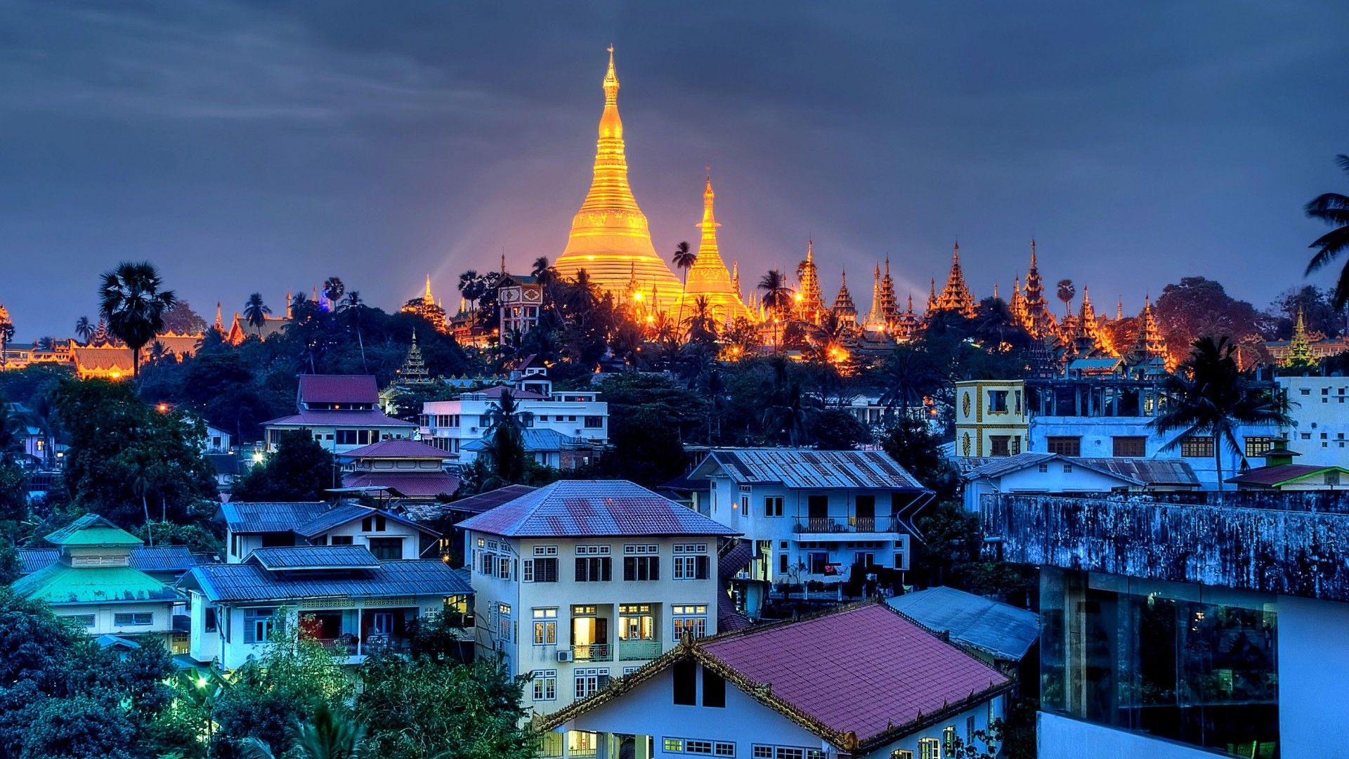 Myanmar: The Shwedagon Paya in Yangon, Singuttara Hill, Greater Dragon Pagoda. 1920x1080 Full HD Background.