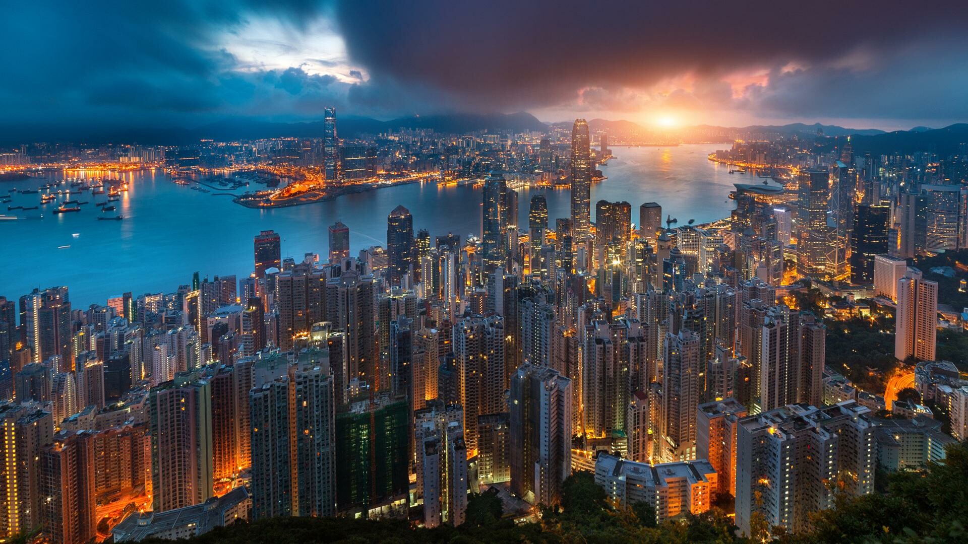 Hong Kong: Skyline, HKSAR, Buildings, Sunset. 1920x1080 Full HD Background.