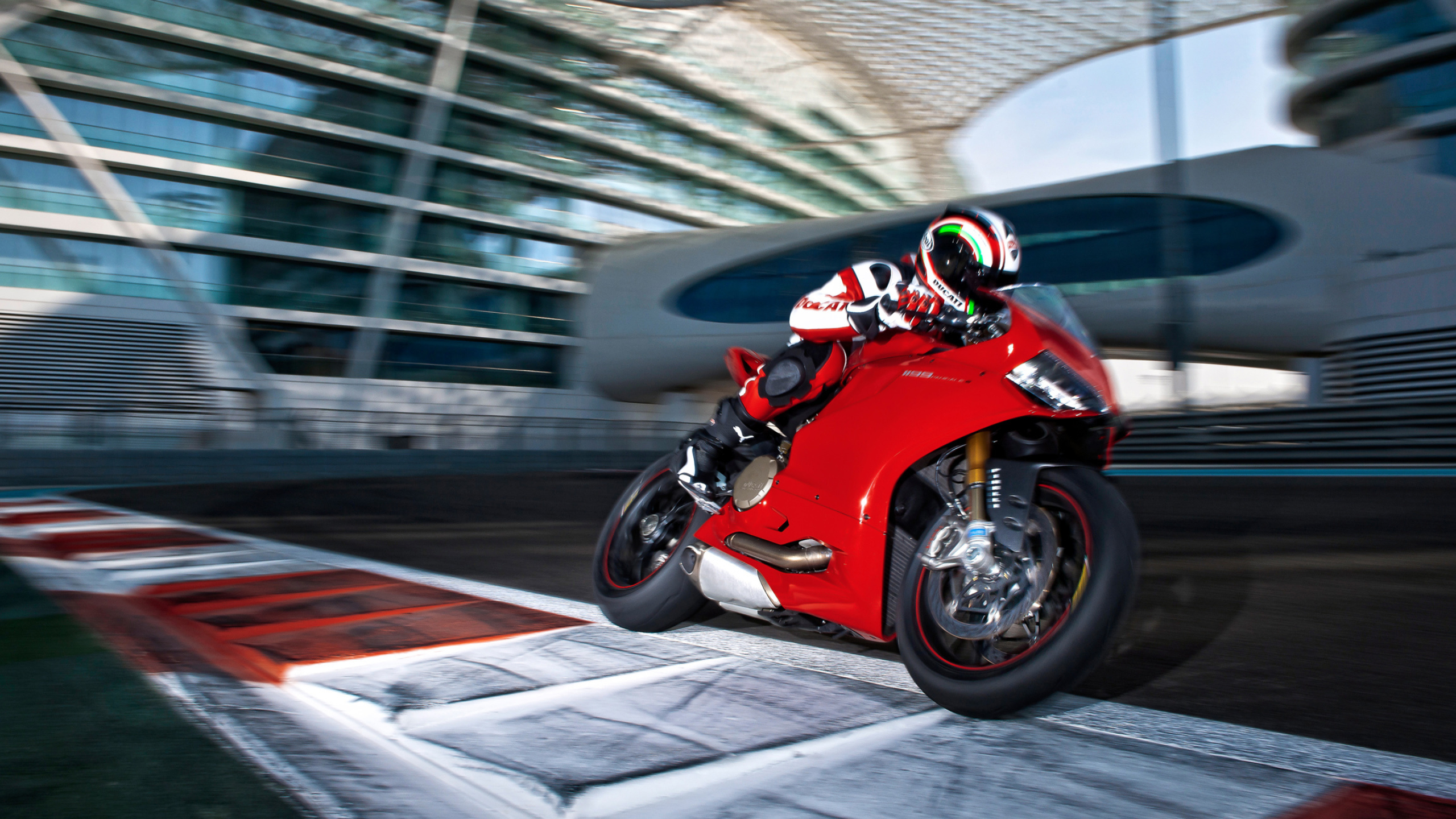 Superbike: Ducati 1199 Panigale at a circle race track, Professional moto sport, Extreme racing. 2560x1440 HD Background.