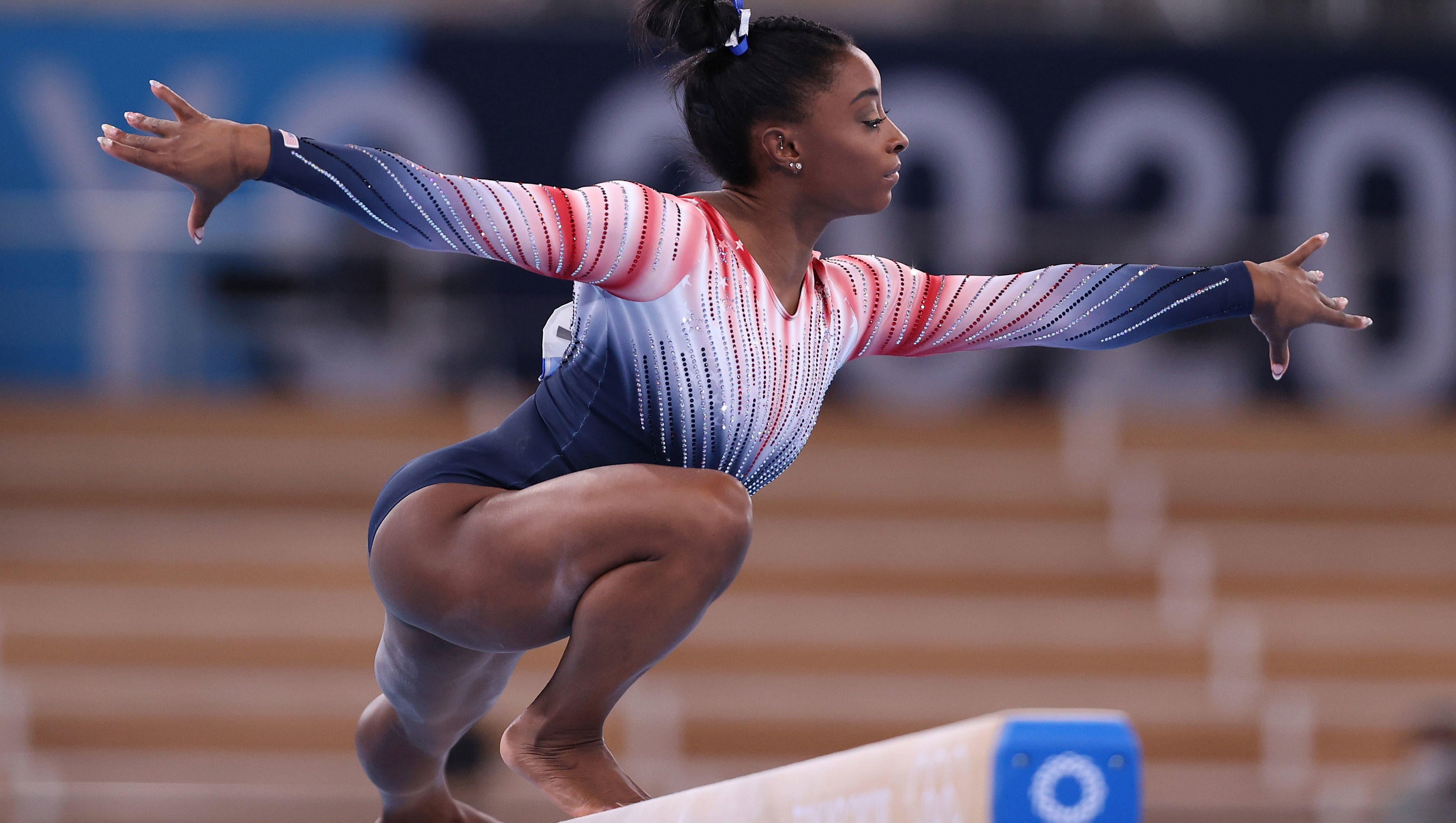 Balance Beam: Simone Biles, The 2020 Tokyo Summer Olympics bronze medalist. 3450x1950 HD Background.