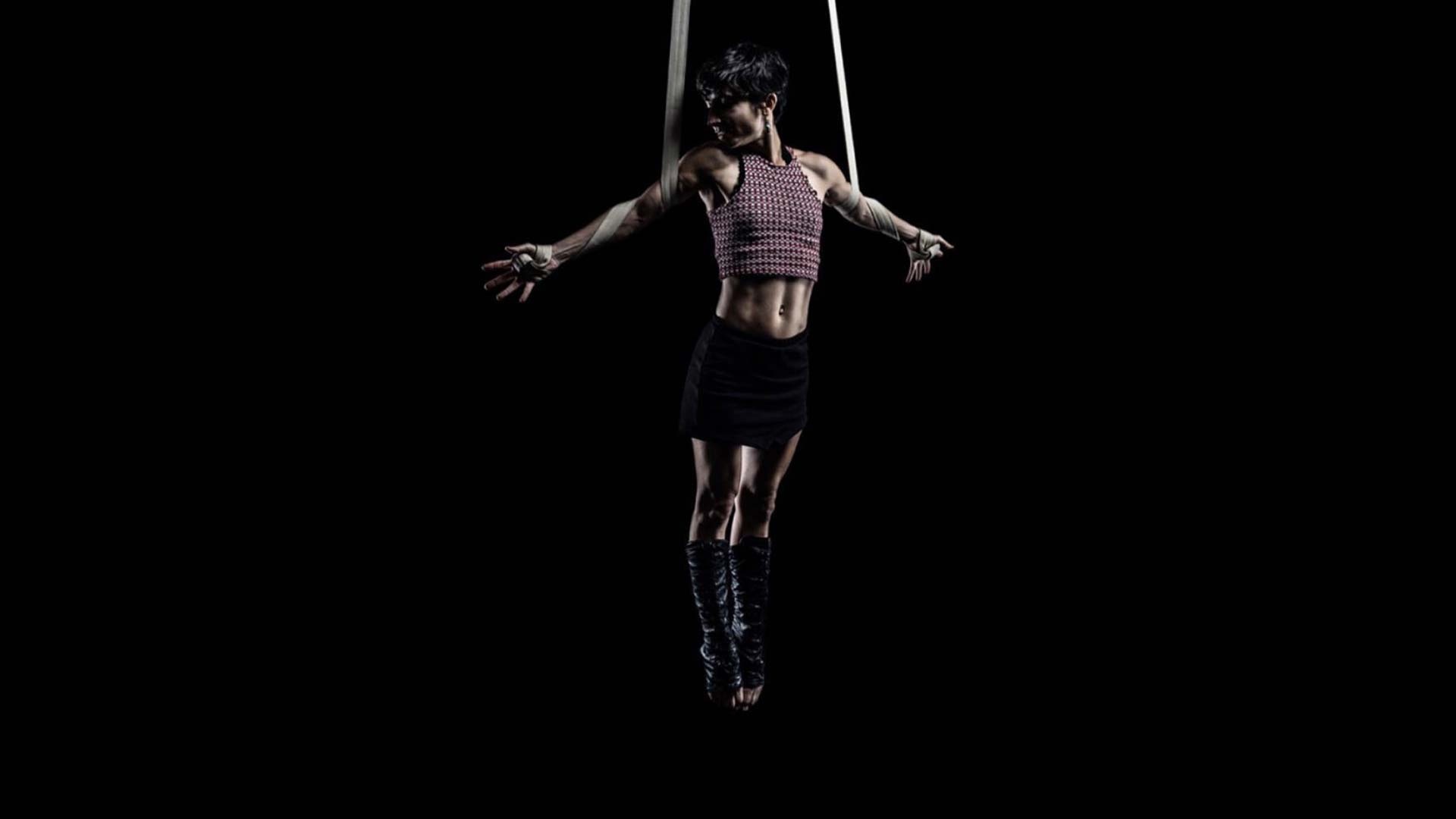Aerial Silks: A professional gymnast performs in the darkness, An amazing circus event. 1920x1080 Full HD Wallpaper.
