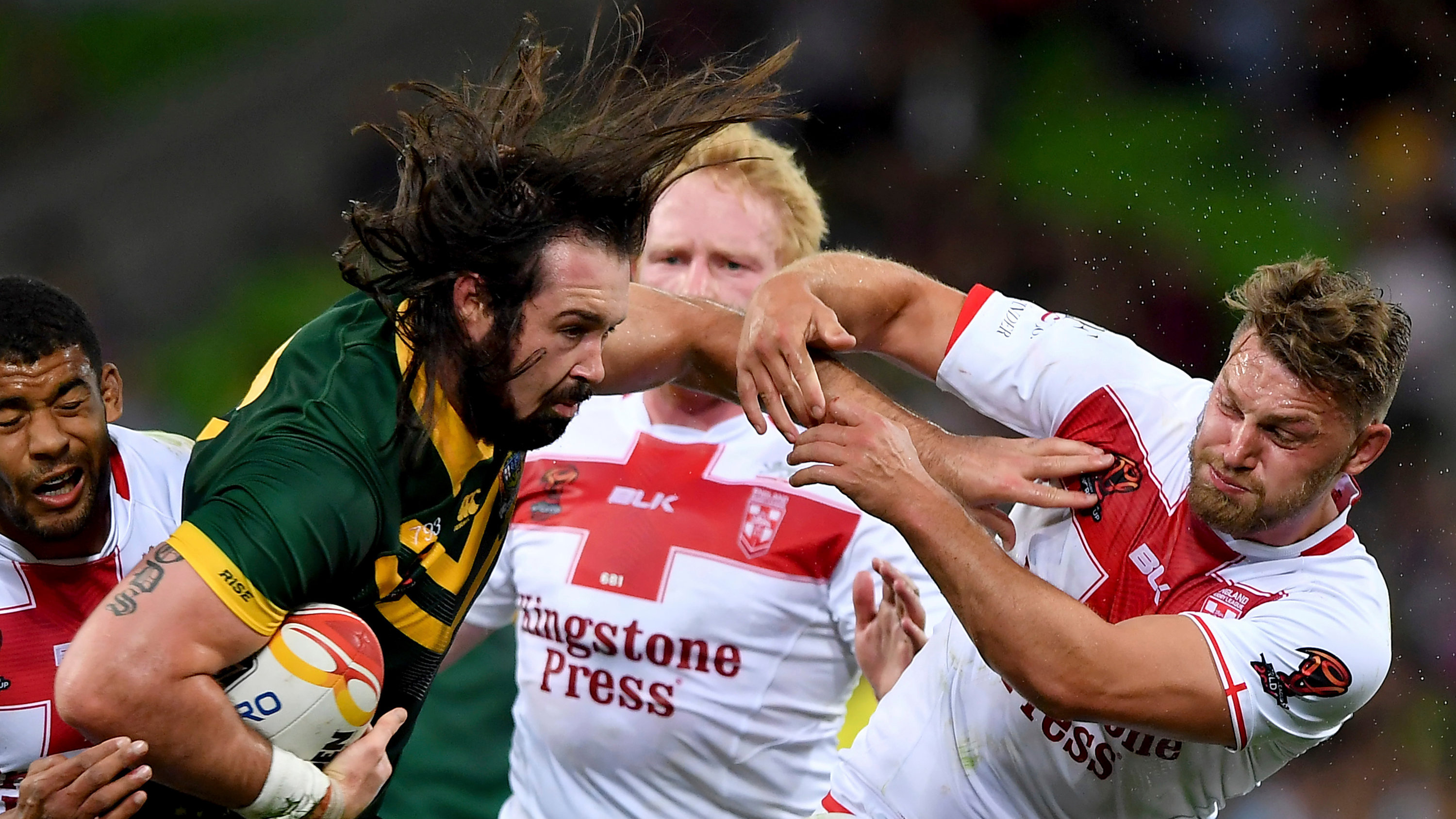 Rugby League: Australia’s Aaron Woods fends off England’s Elliott Whitehead during the World Cup game in Melbourne, Australia. 3000x1690 HD Wallpaper.