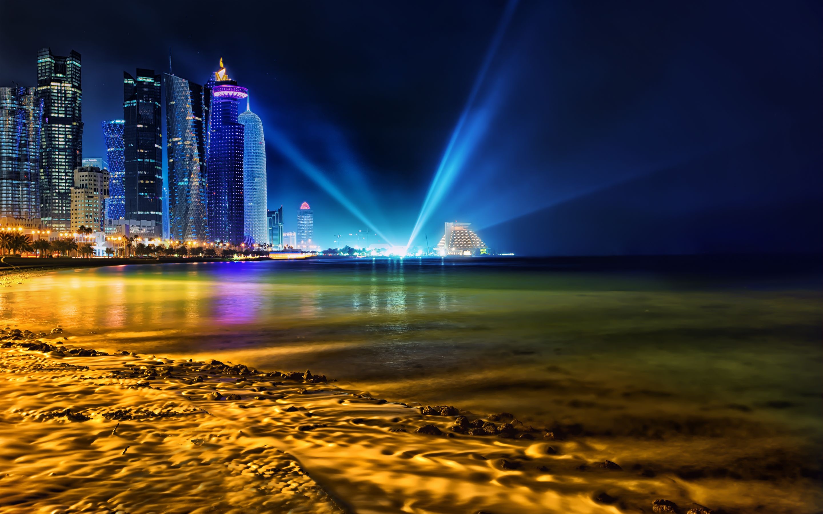 Skyline: The coast of the Persian Gulf, Incredible night Doha - the capital of Qatar. 2880x1800 HD Wallpaper.