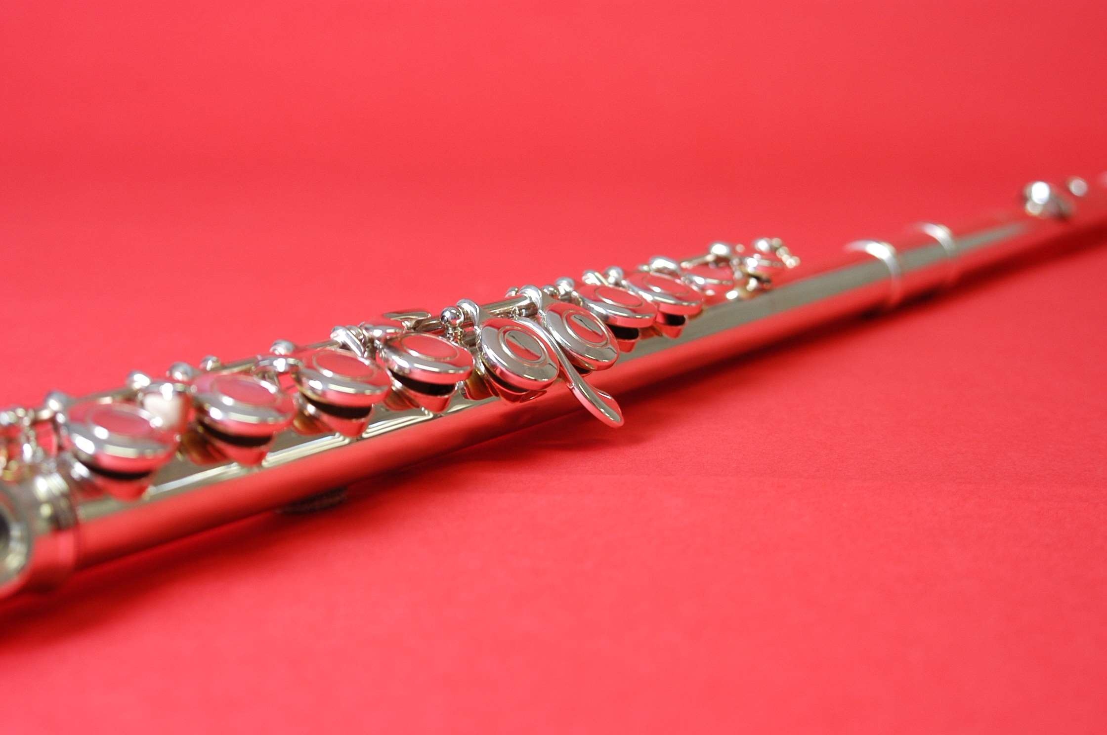 Flute: The modern orchestral wind instrument made of metal with an elaborate set of keys. 2240x1490 HD Background.