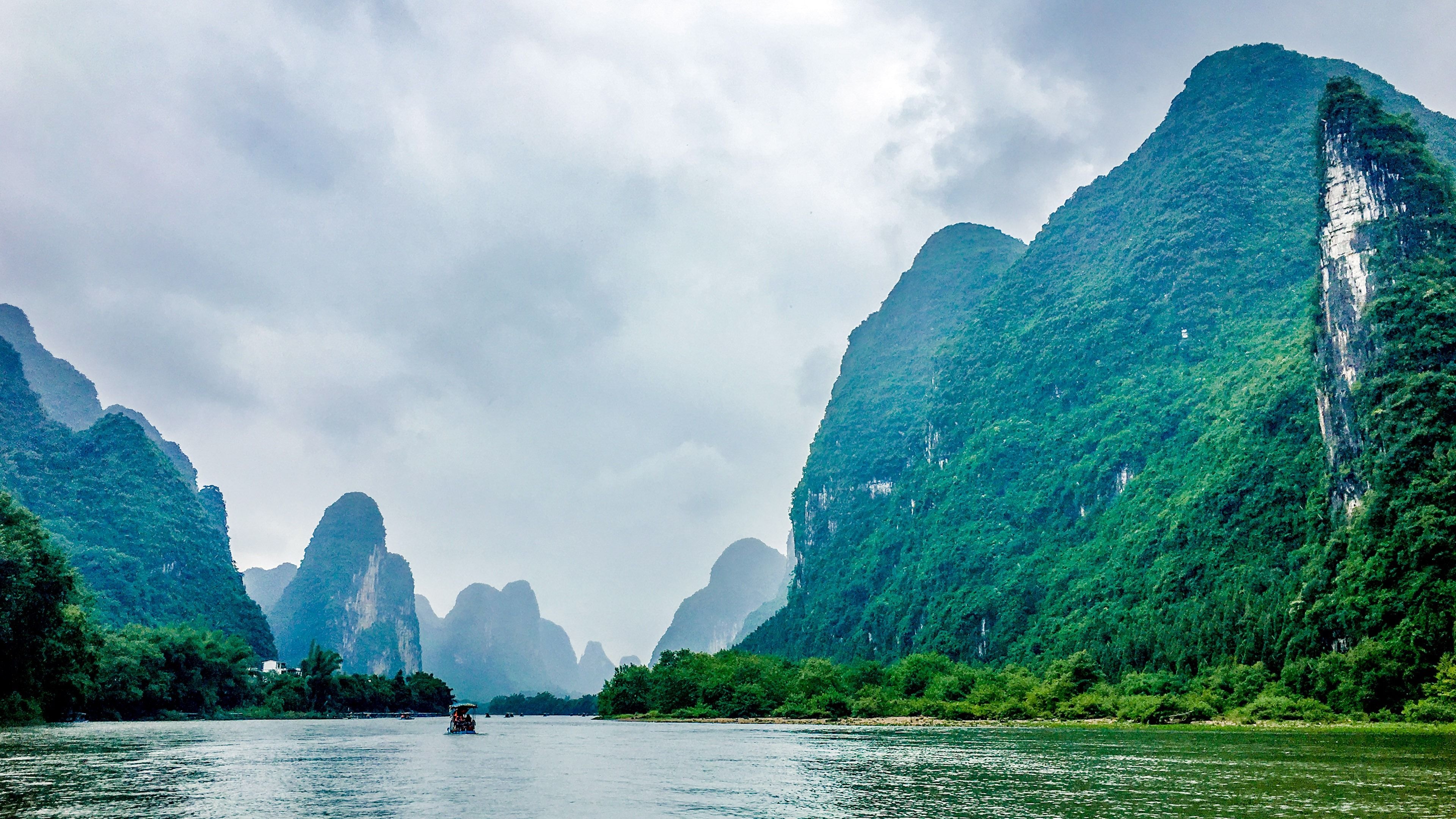 Landscape: The Li River in China, Karst mountains and terraces, Traditional Chinese small boat. 3840x2160 4K Wallpaper.
