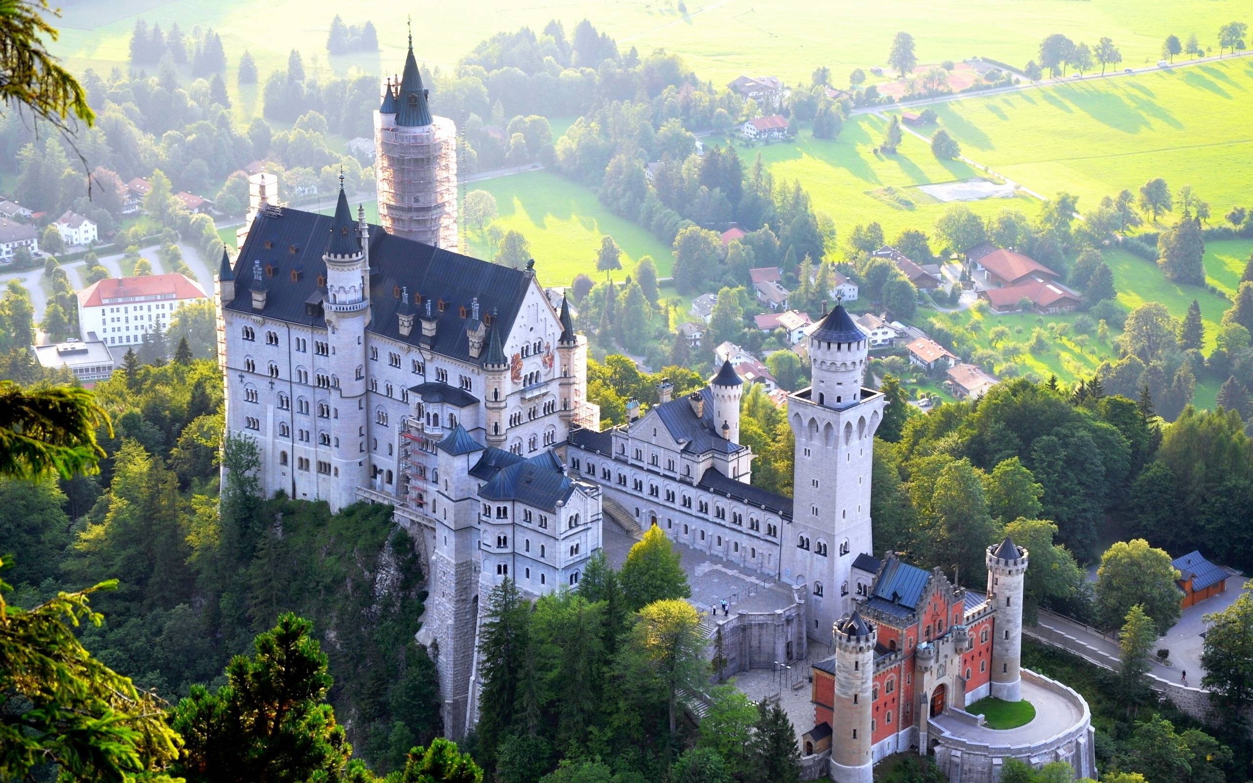 Castle: Neuschwanstein, Fairy tale palace, built atop a rock ledge. 2560x1600 HD Background.