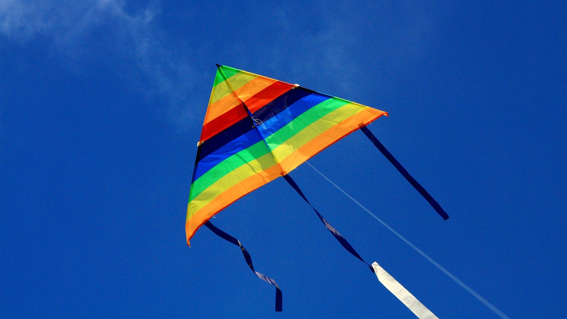 Kite Sports: Delta rainbow kite, Versatile design, Towing point, Blue sky. 1920x1080 Full HD Background.