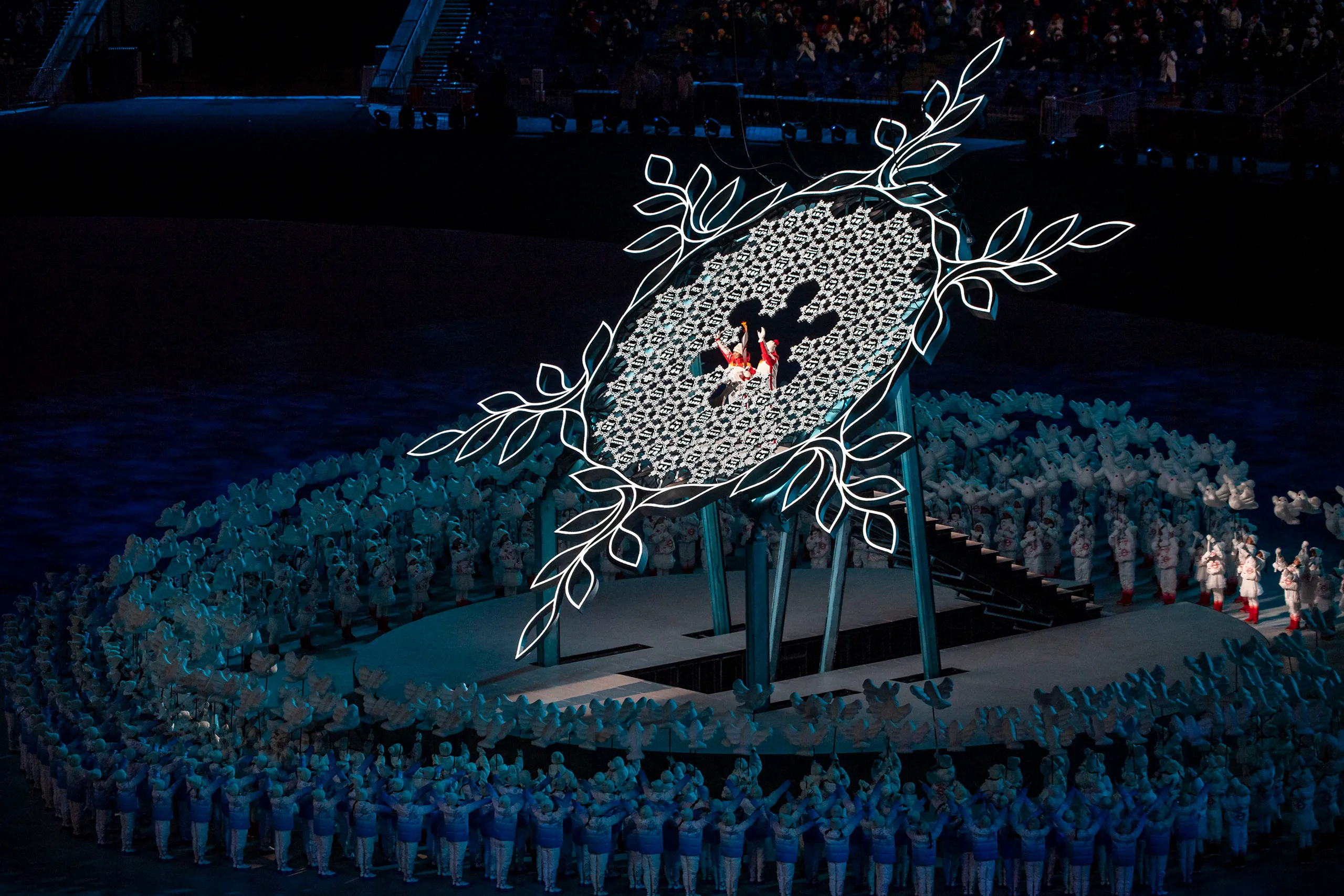 Olympic Flame: Dinigeer Yilamujiang, Zhao Jiawen, The Opening Ceremony, Beijing National Stadium, February 4, 2022. 2560x1710 HD Background.