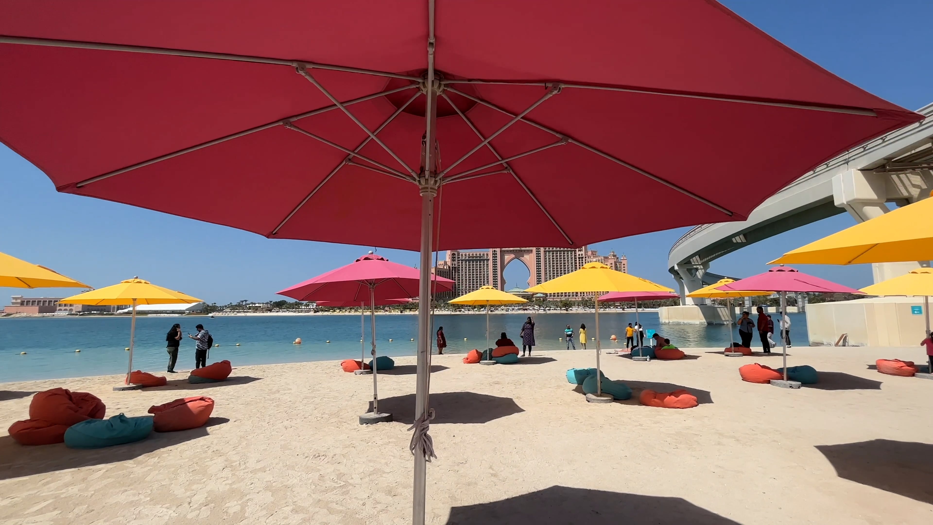 Beach Umbrella: Circular canopy mounted on a central rod, Recreation. 3840x2160 4K Background.