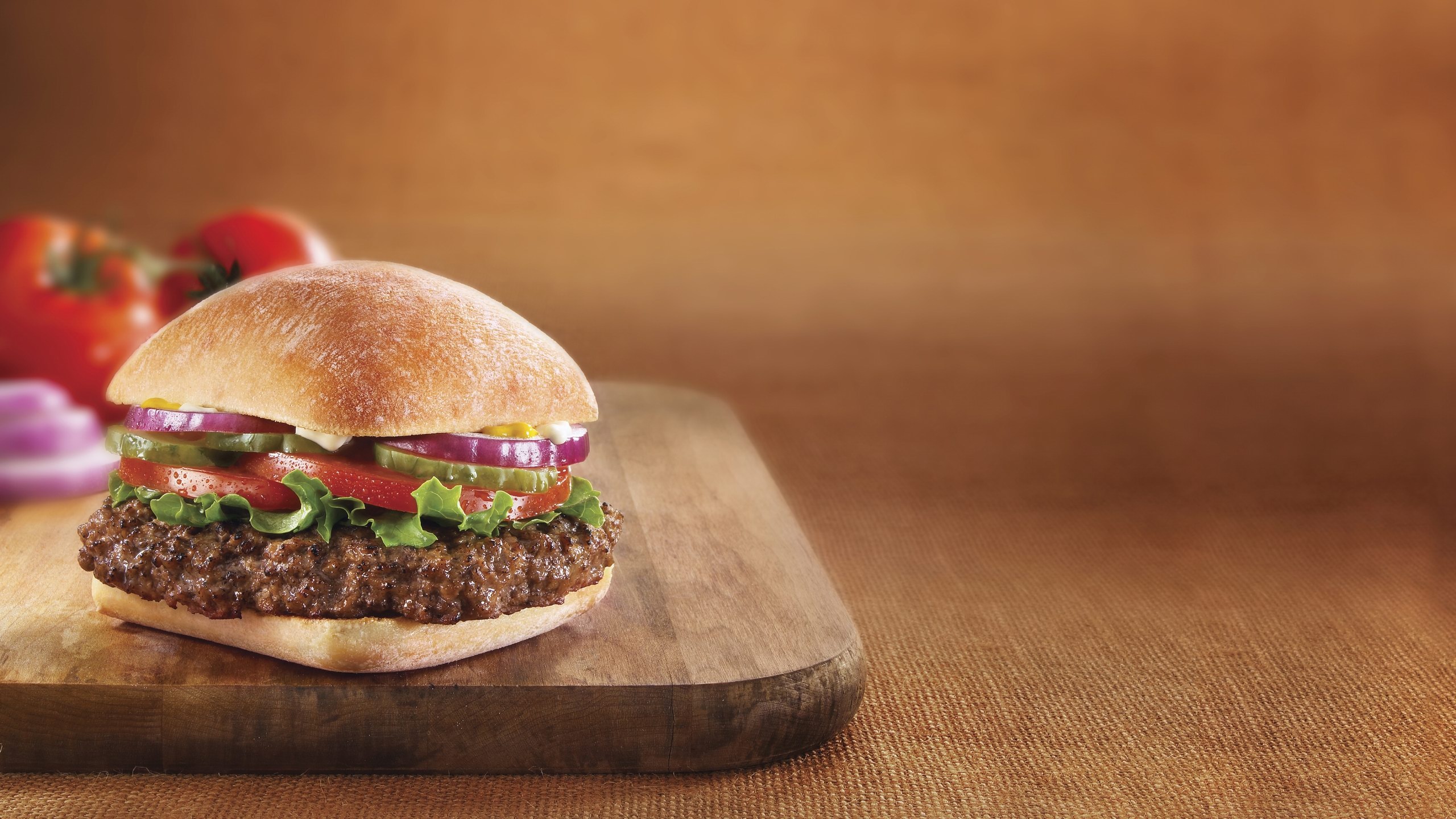 Hamburger: Topped with a slice of cheese, Buns are toasted or grilled. 2560x1440 HD Wallpaper.