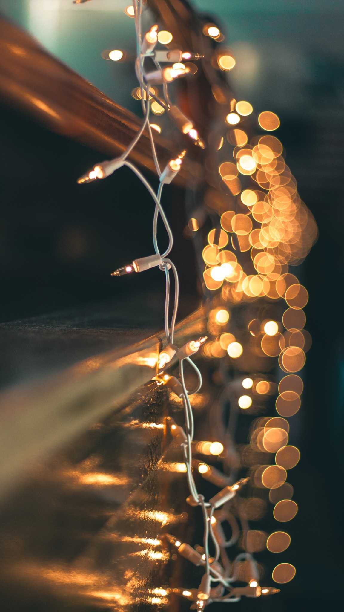 Gold Lights: Hanging Christmas lights, Festive room decoration, Bokeh effect. 1160x2050 HD Wallpaper.
